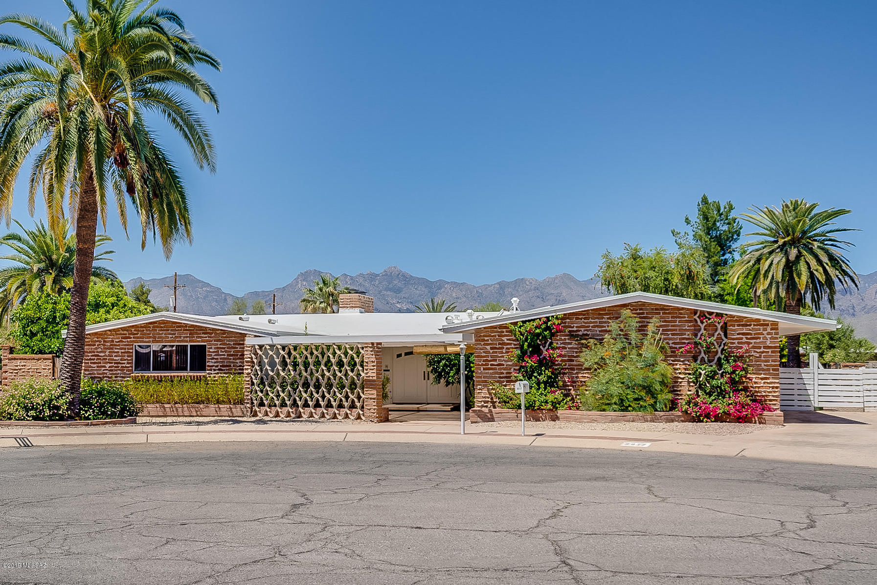 Clean, neat and move-in ready 3 Bedroom, 3 Bath home with almost 3,000 square feet! Beautiful backyard and sparkling pool plus mountain views! Formal Living Room, Dining Room and Den!  Large Family Room! Spacious updated Kitchen with island, stainless appliances, gas top range, double oven and lots of cabinet space! Master has sliding glass door to backyard with private patio! Master Bath offers his and hers vanities and walk-in shower! Located in the Northeast area of Tucson!