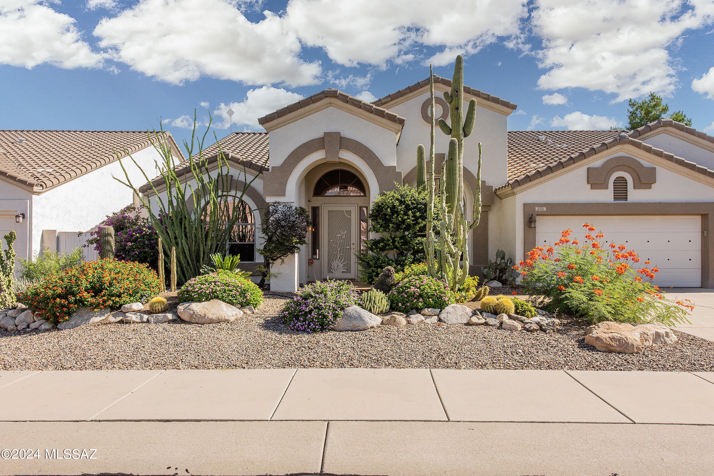 Welcome to this updated Spanish Hacienda-style home in the heart of Oro Valley! Features include vaulted ceilings, bay windows, white interior paint, stone fireplace, beverage bar, and open floor plan. Enjoy a sparkling pool, turf yard, private stucco fence, and 3-car garage. The primary suite has private deck access. Close to shopping, dining & more. A must-see!