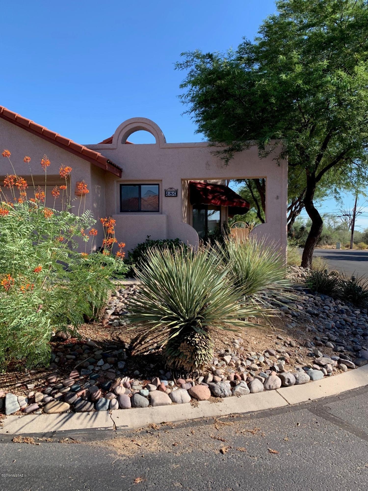 2BR/2BA+Den (1,300 sq ft) fixer upper on corner lot in desirable Villa Balboa in the heart of Oro Valley. Living/Dining room features a vaulted ceiling and woodburning fireplace. Master suite has private bath and dual closets. Enjoy Pusch Ridge views from the rear covered patio and beautifully landscaped yard. Built-in storage cabinets in 2-car garage plus security screen doors and gates throughout. Community pool and spa plus convenient to shopping, dining, entertainment and the Hilton El Conquistador Resort.