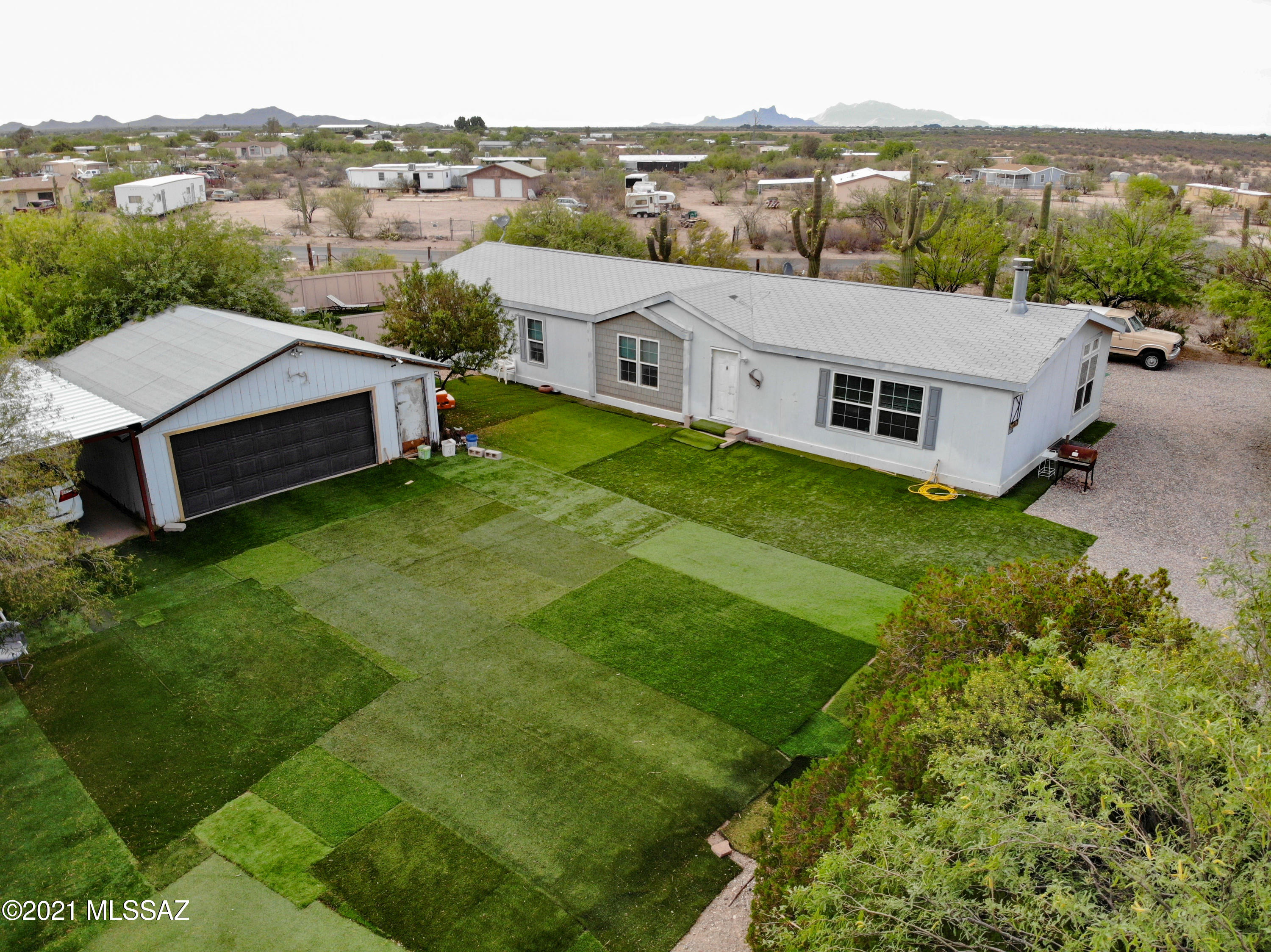 This 3 bed 2 bath home sits perfectly on a fully fenced acre lot with so much to offer. Enjoy your privacy with a gated entry and mature trees surrounding the yard while spending time in the workshop and carport area or hang out by the beautifully maintained pool. This one owner home built on a strong foundation has been updated with a Southwesten style offering tile in the main living space and backsplash in the kitchen. Walk through the sliding glass door in the master bedroom and straight into the pool area! Pride in ownership and a must see!