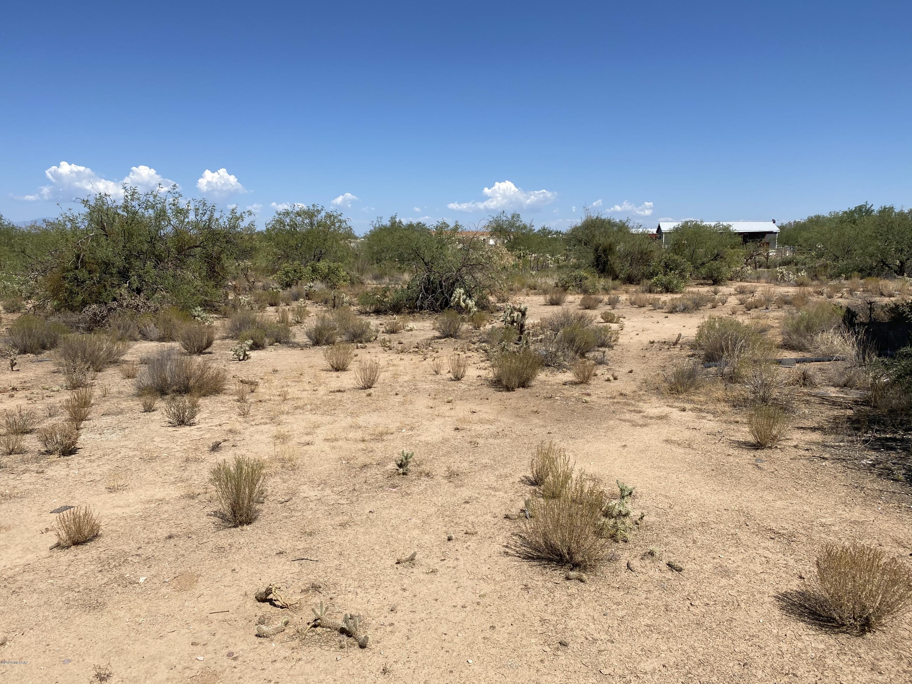 Over 2 acres of property in southwest Tucson. Savor the tranquility of wide open spaces and sweeping mountain views all within easy reach of metropolitan conveniences. Build your dream home and enjoy the ways of southwest living! Two structures on the property will convey as is.
