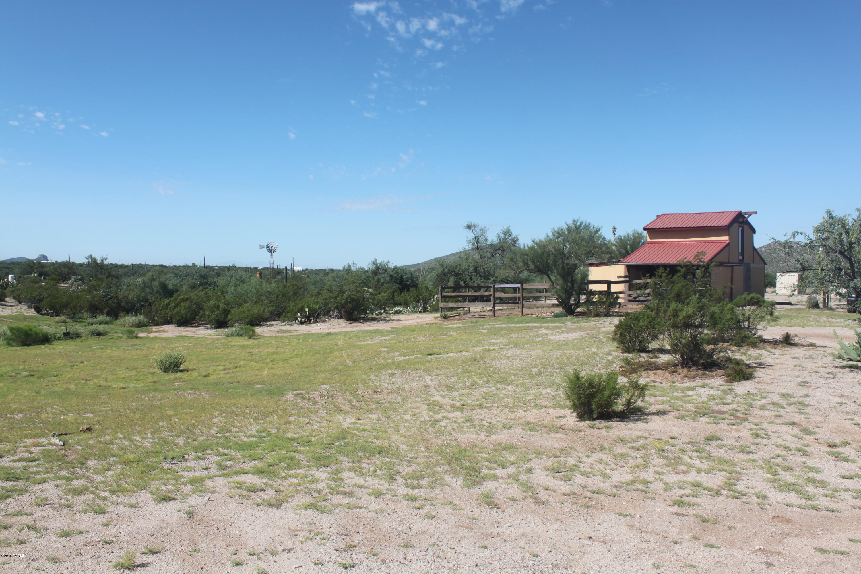 3.42 Acre Horse property nestled in picturesque setting ideally situated within approximately 15 minutes from Catalina NW Tucson. A well built barn with w/Loft, tack rooms,(1)24X24 and (1)15X17 horse stalls. Easily install a new Mfg Mobile home or easy site build with existing utilities already installed. Water well with only 2 shares. Enjoy this country living at its finest for a very low price.