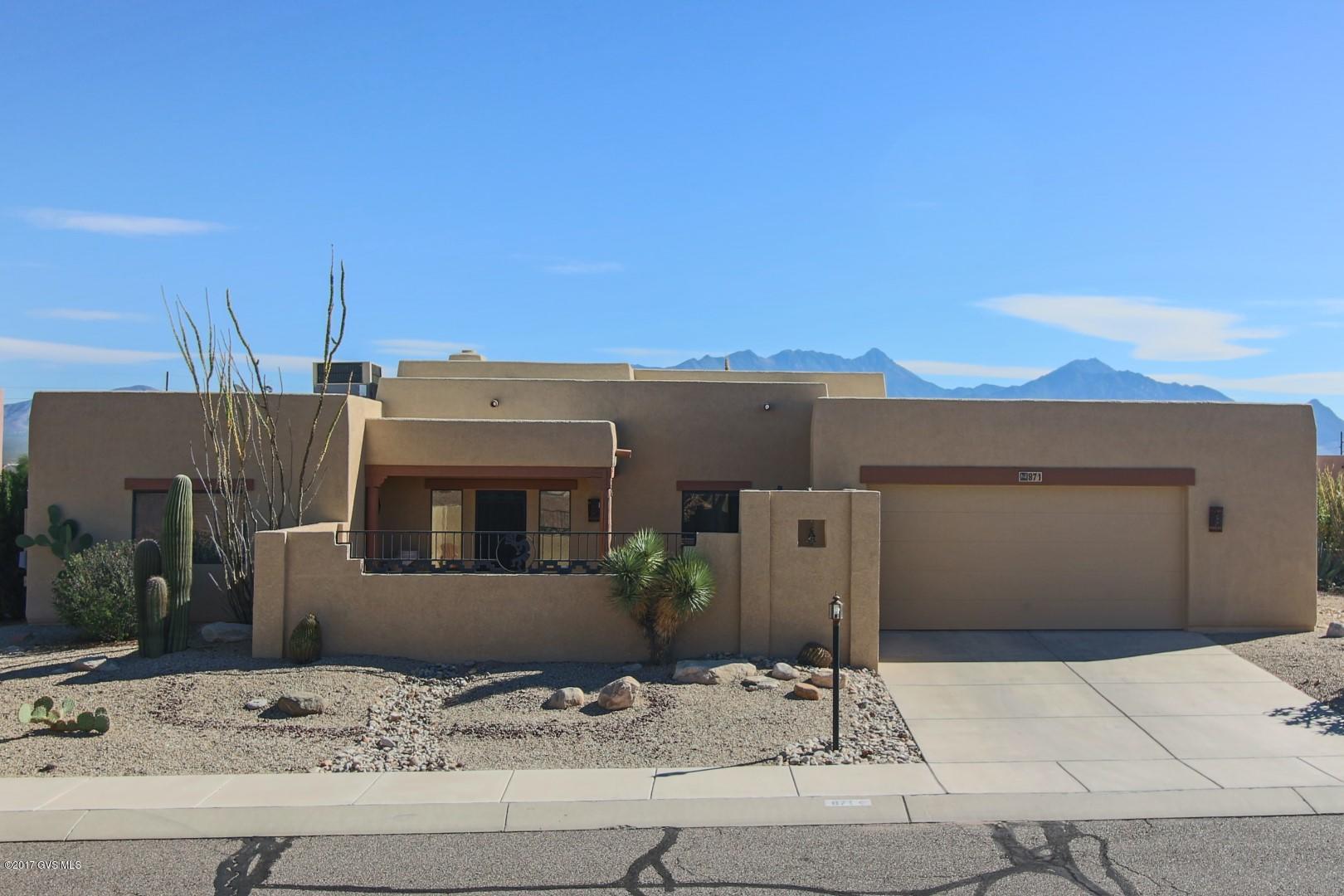 A stunning mountain view from this gorgeous southwestern home. A little over a third of an acre lot in the prestigious Portillo Ridge neighborhood. A move in ready home with all the bells and whistles. The moment you step in you are greeted with spectacular mountain views, exposed beams and a large beehive fireplace. You have two bedrooms with a large den and two baths. A nice split bedroom plan. The kitchen is loaded with granite, tiled back splash, upgraded appliances and a lovely pantry. The laundry room is large with tons of storage. The 2.5 car garage also has storage. The back patio gives you awesome mountain views and a gas fire pit. A truly must see!
