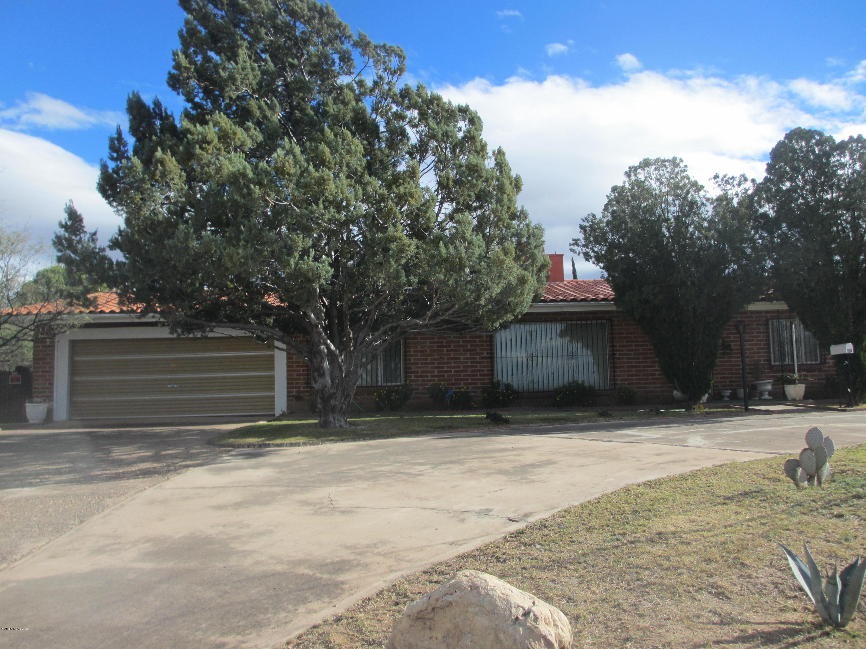 A VERY NICE, CLASSY, COZY, WELL MAINTAINED HOME IN THE HEART OF NOGALES!! HOUSE SITS ON A LARGE LOT ON TOP OF A HILL WITH GORGEOUS VIEWS!!! THIS BEAUTIFUL 2346 SQ FOOT HOME HAS LOTS OF AMENITIES INCLUDING NICELY LANDSCAPED YARDS, BLOCK WALLS, TILE ROOF, 2 WAY FIREPLACE, HUGE 2 CAR GARAGE, PATIO/DECK AZ SUN ROOM, BUILT-IN SHELVING, SECURITY DOORS AND MUCH, MUCH MORE!!
