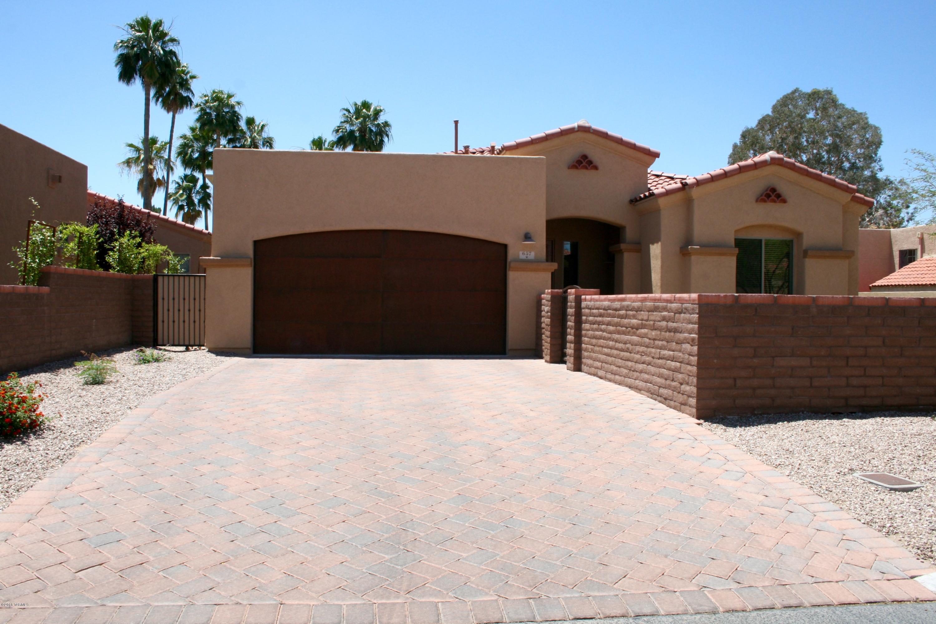 This home is situated in a beautiful gated community that is within walking distance of shopping and dining.  It offers an extra large front courtyard with brick pavers that give a welcoming invite. The home itself offers numerous upgrades including large gorgeous tile throughout except for bedrooms, granite counter tops, ss appliances, beautiful master bathroom with separate shower and garden tub, separate vanities and glass tile back splashes.  The garage offers a 2 ft extension.  The yard is also a great size.  This property and community is a must see.  Seller is licensed to sell real estate in Arizona.