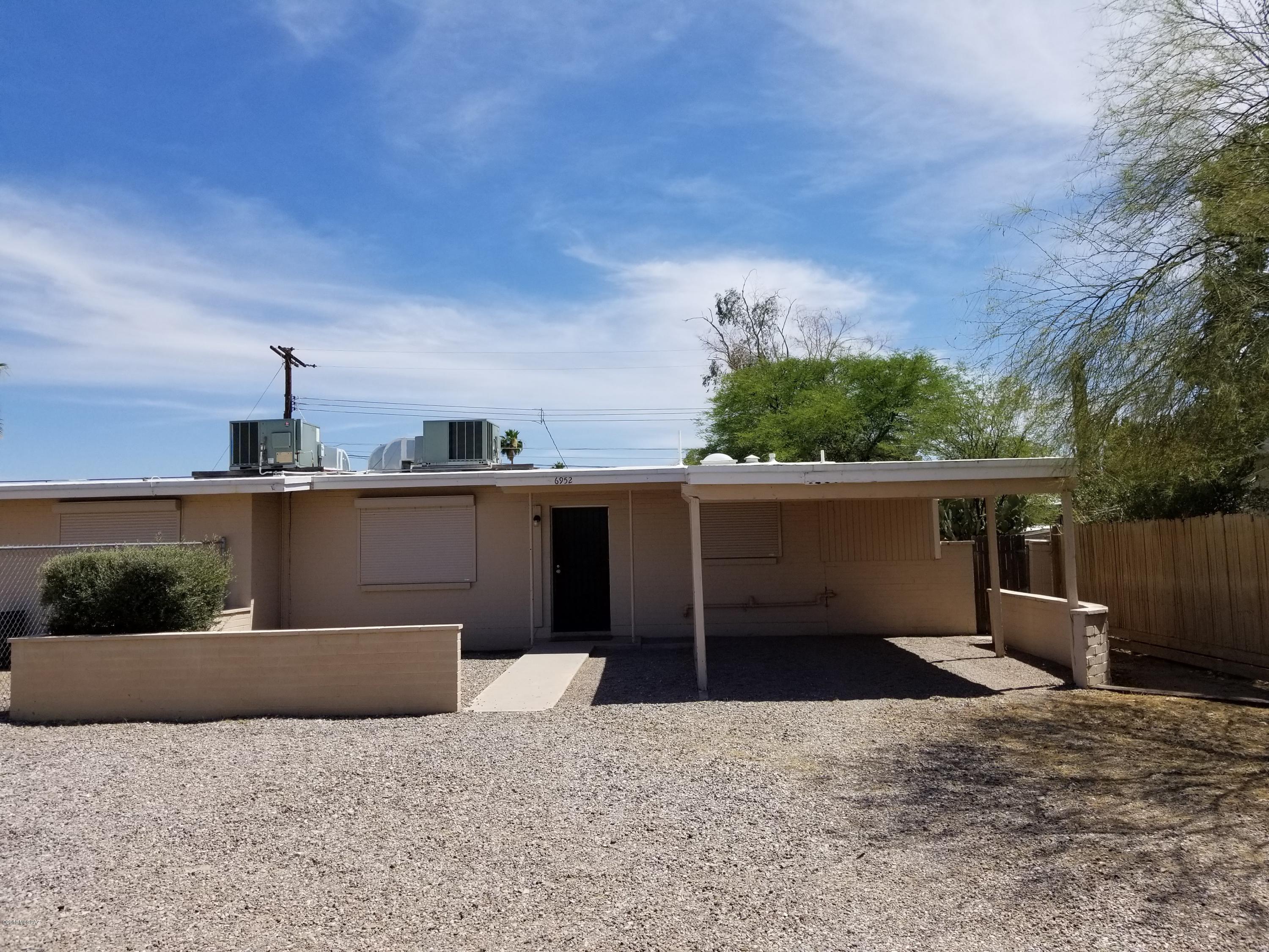 Conveniently located 2 bedroom, 1 bathroom property. Walmart, Lowes, movie theater and several restaurants within walking distance. Also located on the bus line with easy access to the University of Arizona. All new appliances, freshly painted, and ready to move in. Rolling shutters add to privacy and safety and block out light for day sleepers too! A/C for those hot summer months. Located on Speedway but well insulated to block out sound. Large front and rear yards both fully fenced.