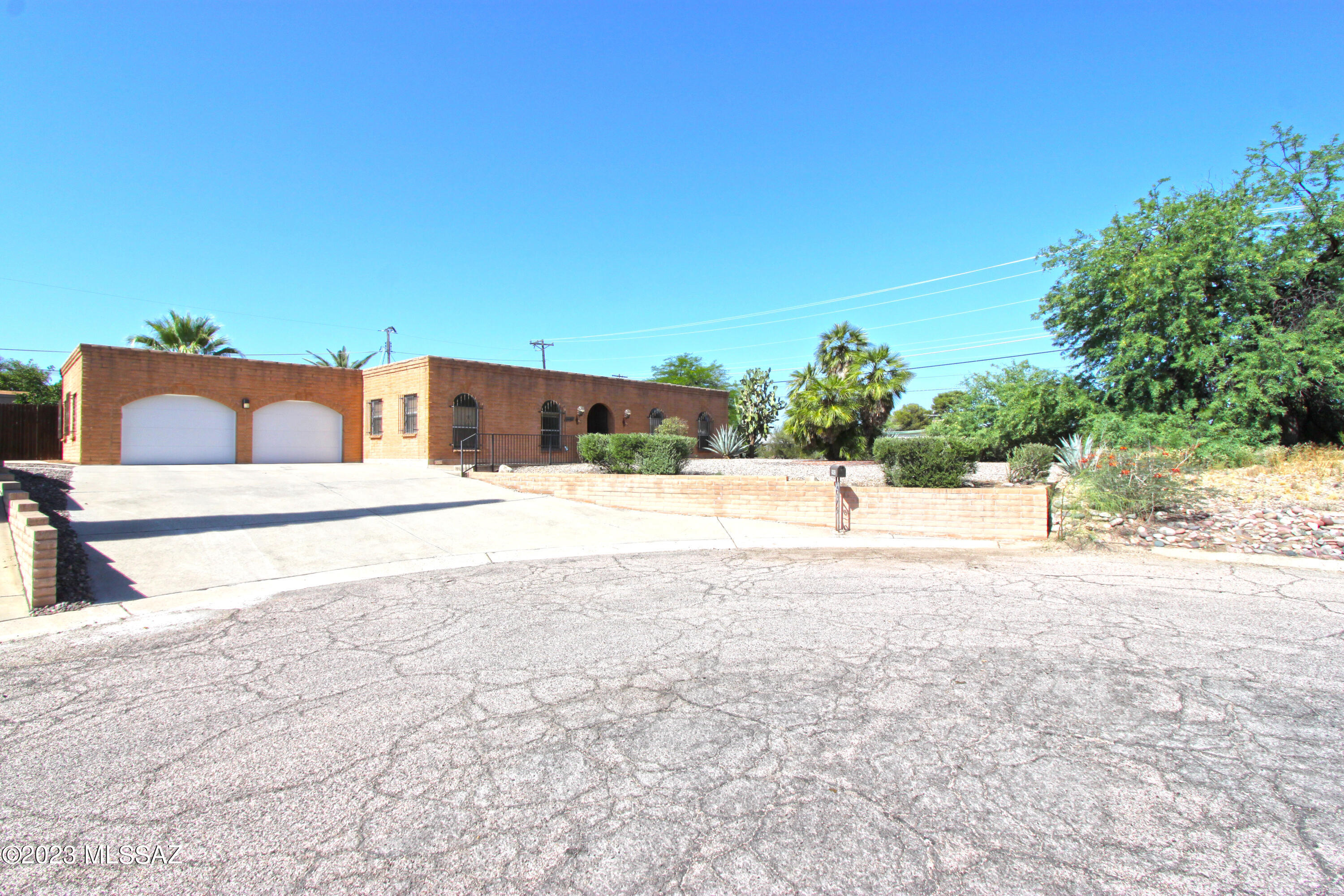 Incredible location, meticulously clean and amazing features. If you are searching for a classic Tucson home in an ideal location close to costco, TMC and dozens of great shopping plazas, this is it! Key features that set this house apart from the competition is the large yard with TWO storage sheds, an oversized 2 car garage and a quiet cul de sac. There is a large gate in the back yard with access from the alley to store extra stuff in back yard. The layout is perfect for a variety of uses and the classic brick style means you wont need to be repainting your exterior every 5 to 7 years. The primary bathroom was tastefully remodeled and is unusually large for this era of home. Many updates and maintenance items have already been completed, so all you need to do is move in!