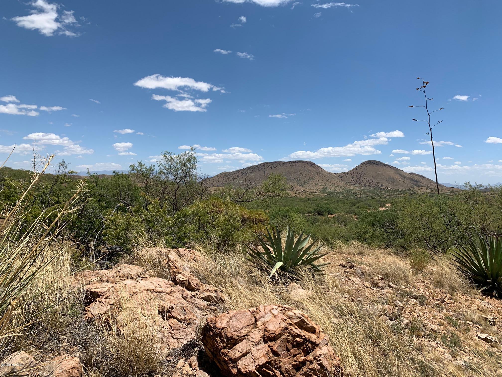 9.95 view acres in the rolling hills near the old mining ghost town of Gleeson, AZ. Oak studded hillsides with far away views. Looking for a semi remote weekend getaway or hunting camp, then this is the property for you. Located 30 minutes east of historic Tombstone, AZ when you feel like going out on the town!