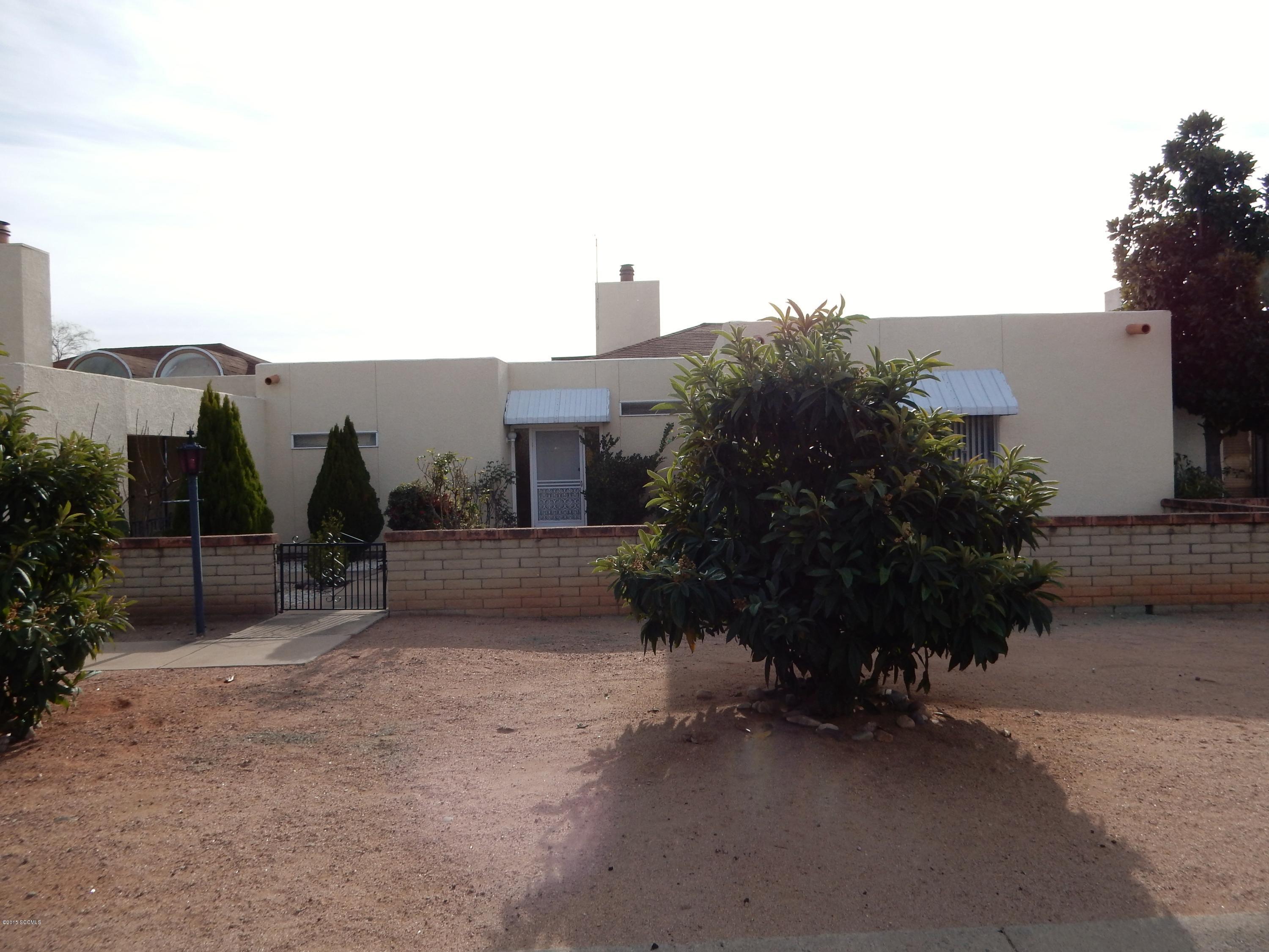Excellent Location! Views! GATED community.Cozy Desert Dawn townhome. Community POOL & Clubhouse. Close to Walking Path, Coatimundi Middle School, Fitness Ctr, Golf and I-19. Covered patio to enjoy views. Stairs stepping down to Avenida Coatimundi for path enjoyment.