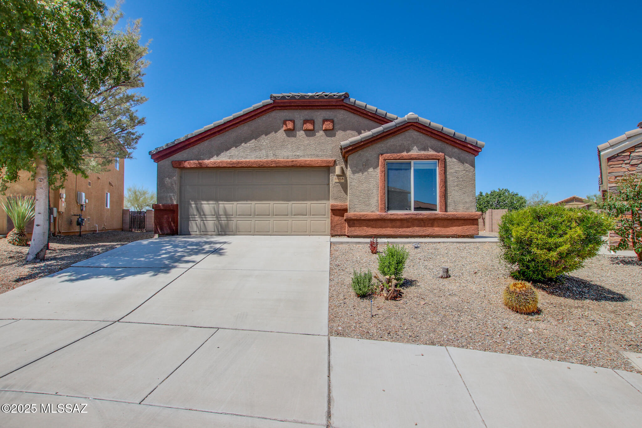 Welcome to this beautifully maintained 4-bedroom, 2-bathroom home nestled in the desirable Sycamore Point Community, located within the award-winning Vail School District. Built in 2013 and offering 1,598 sq ft of living space, this home combines comfort, style, and convenience with easy access to I-10 and stunning mountain views.

Step inside to discover a bright and airy interior with a light color palette, high vaulted ceilings, and durable vinyl flooring throughout. The thoughtfully designed split floor plan provides privacy, with a spacious primary suite featuring a walk-in closet and a luxurious en-suite bathroom complete with dual sinks, a separate shower, and a relaxing tub. The kitchen is a chef's delight, offering generous counter space, plentiful cabinetry, and newer... appliancesperfect for preparing meals and entertaining guests.

Enjoy Arizona living at its finest in the expansive backyard with no rear neighbors. Unwind around the fire pit, challenge friends at the horseshoe throwing area, or relax under the full-length covered porch and cozy pergola with a built-in sitting nook.

This move-in-ready gem is a must-seeschedule your private showing today!