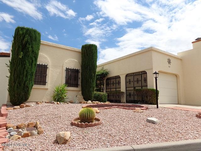 There is a lot to love about this Continental Vistas Townhouse! Just the right size - 1252 sq.ft., 2 bedrooms, 2 bathrooms, a 1-car garage. Gorgeous backyard & arroyo & mountain views can be enjoyed from the living room & back bedroom. The screened-in back patio doesn't obstruct the great views, plus pavers extend the patio area. A beautiful updated kitchen with granite countertops plus quality stainless appliances that are amazing. Because the back bedroom has a built-in murphy bed, cabinets, & desk, it can be converted into a den or office/playroom. The 1-car garage/carport is unique with a security door wall on one side. Continental Vistas has its own pool, spa, & clubhouse, but this home is also in a great location - close to the West GVR Rec Center, shopping, business, & restaurants.