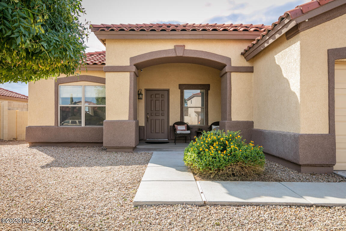 Immaculate 4bd, 2ba, single-story gem! Pride of ownership shines in this spacious, well-maintained home.  This clean 4bd, 2ba, 2166 sq ft property is the largest single-story floor plan in Cortaro Ranch!  Large kitchen with stainless steel appliances and island. Peaceful backyard with a covered patio and travertine flooring, privacy fencing, and a putting green to perfect your golf game.  An additional patio with pavers, flagstone seating, and a built-in firepit makes this home not only a sanctuary, but ideal for entertaining.  Don't miss out on this picture-perfect home!