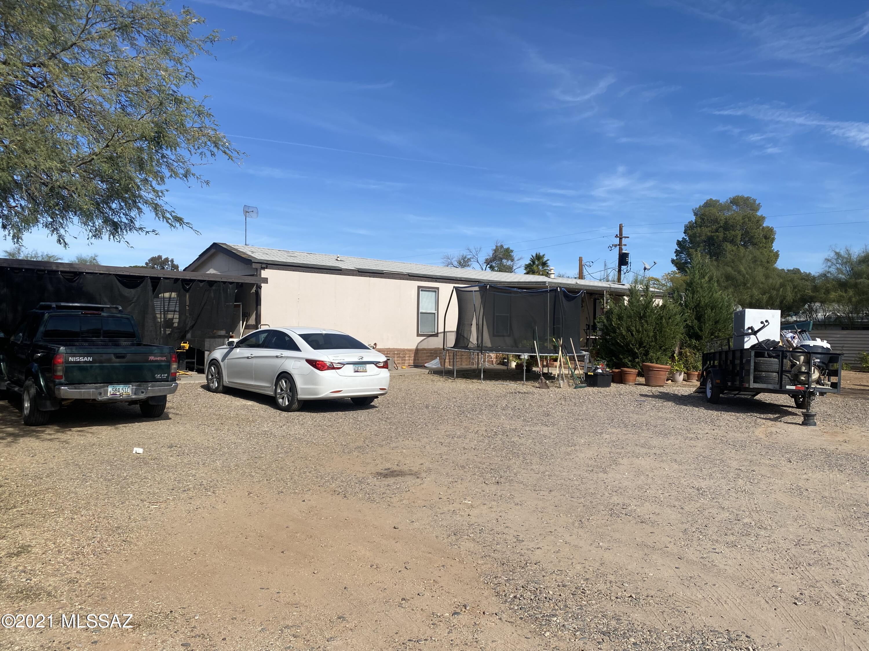 Enjoy the peace and tranquility of Catalina living. This 2001 Desert Villa by Fleetwood features 3 bedrooms, 2 full baths, open kitchen, laundry area, and large master suite. Property has 2 sheds and is fully fenced. Beautiful mountain and sunset views. Home is  being sold as is.