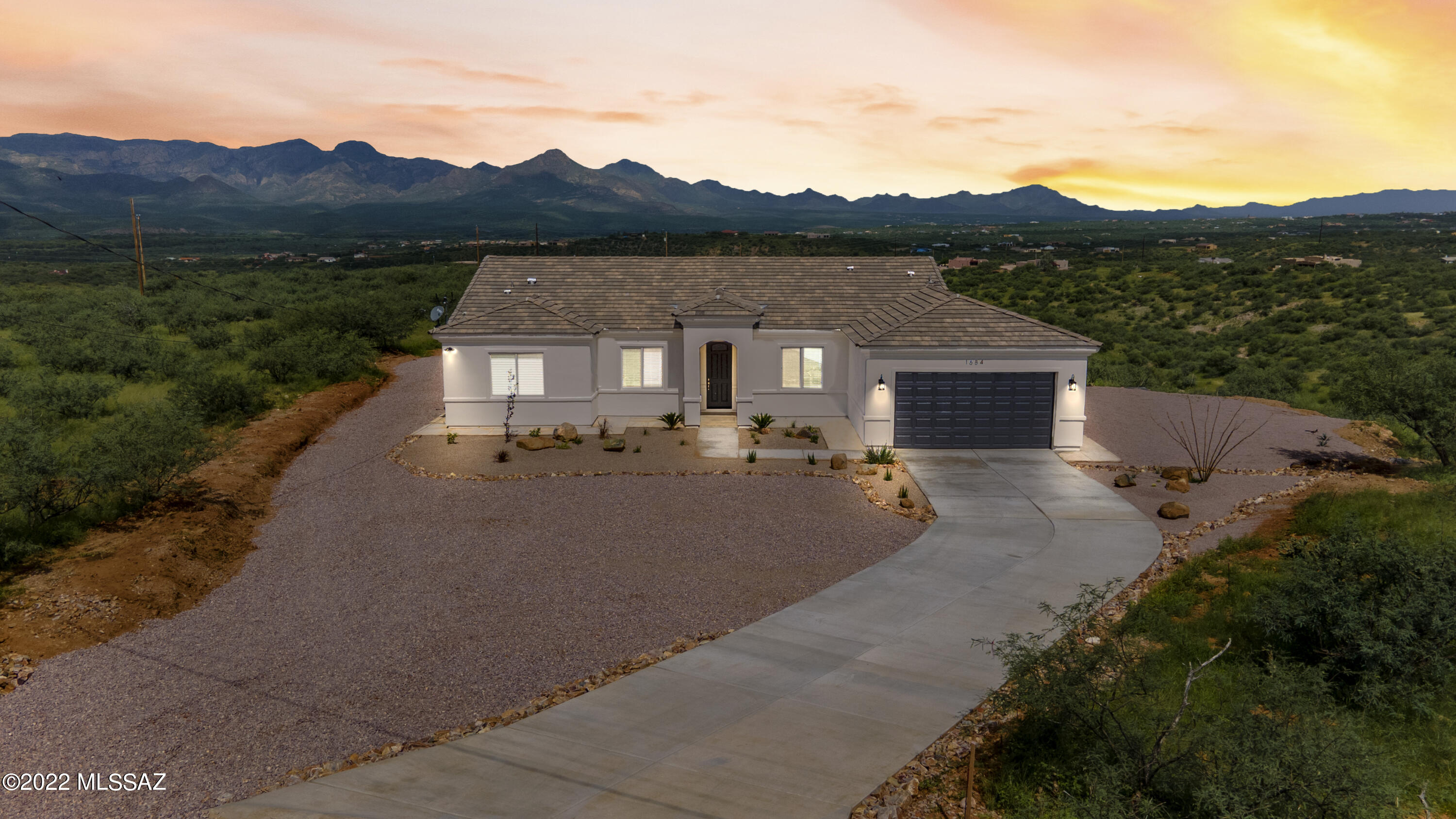 Outstanding! 4-bedroom 2-bathroom home features granite countertops, stainless steel appliances including refrigerator, plentiful cabinets, and gorgeous tile throughout. sizable closets. his & her vanities. The master bedroom is fully equipped with a walk in closet and private bathroom with walk-in shower, beautiful curb appeal. and mountain views. Desert land scaping with irrigation system. Enjoy your time on the covered back patio, This home sits on a cul-de-sac. Don't miss out come and make this your new dream home.