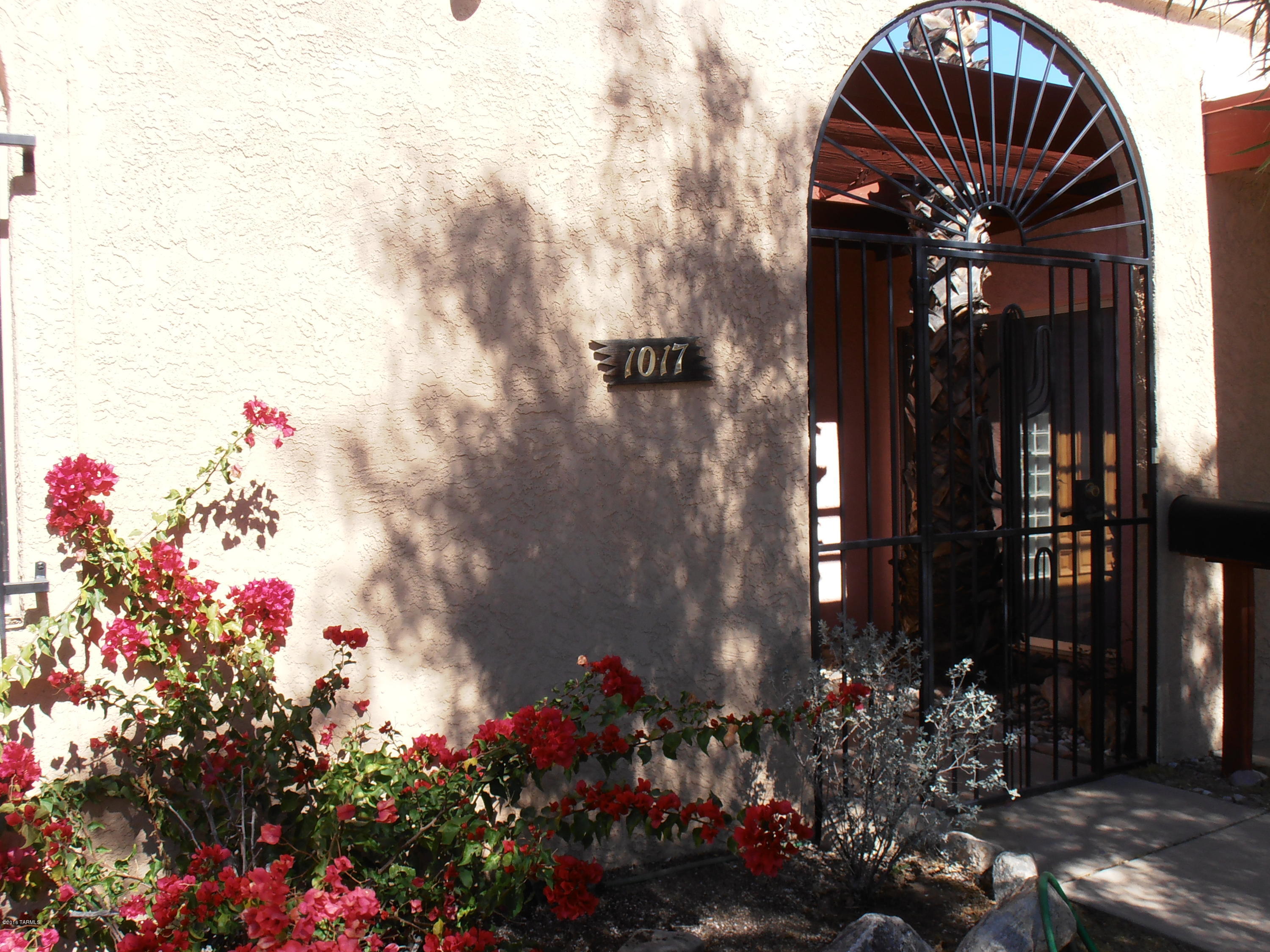 Great little town home in a convenient central location. Attractive courtyard entry, natural wood entry door with glass block side-light plus tiled foyer w/coat closet. Efficient galley kitchen w/breakfast nook overlooking the entry courtyard. Guest bedroom features built-in bookshelves for double duty as a home office. North facing back yard features a covered patio & mountain views. Minutes from Bookman's, Beyond Bread, Trader Joe's, Carondolet & Tucson Medical Center!