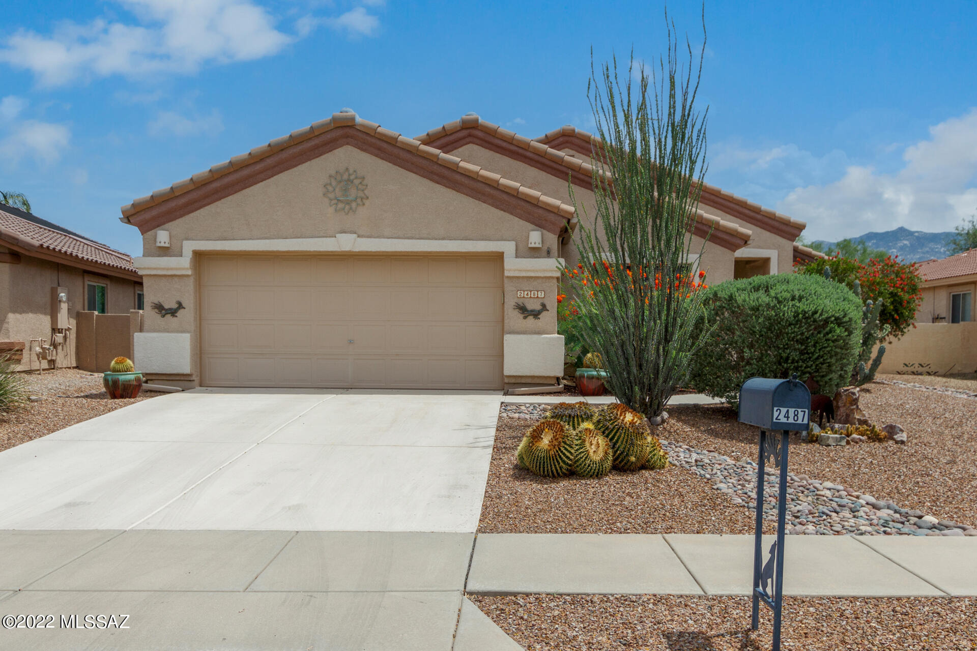 Beautiful three bedroom home available in the sought after Rancho Vistoso! Wonderful curb appeal with two-car garage, vibrant desert landscape, & gorgeous mountain views. Come inside the welcoming foyer to discover tile flooring, bright palette, & vaulted ceilings. The spacious great room with inviting fireplace offers an open concept with backyard access. The pristine kitchen showcases shaker cabinetry, granite countertops, and an oversized island with breakfast bar. The master bedroom boasts wood-look flooring, lavish ensuite with dual sinks, marble finishes & walk-in closet. Enjoy the fantastic backyard with relaxing covered patio, desert landscape, pavers, & built-in BBQ. Home is conveniently located near parks, hospital and grocery stores.