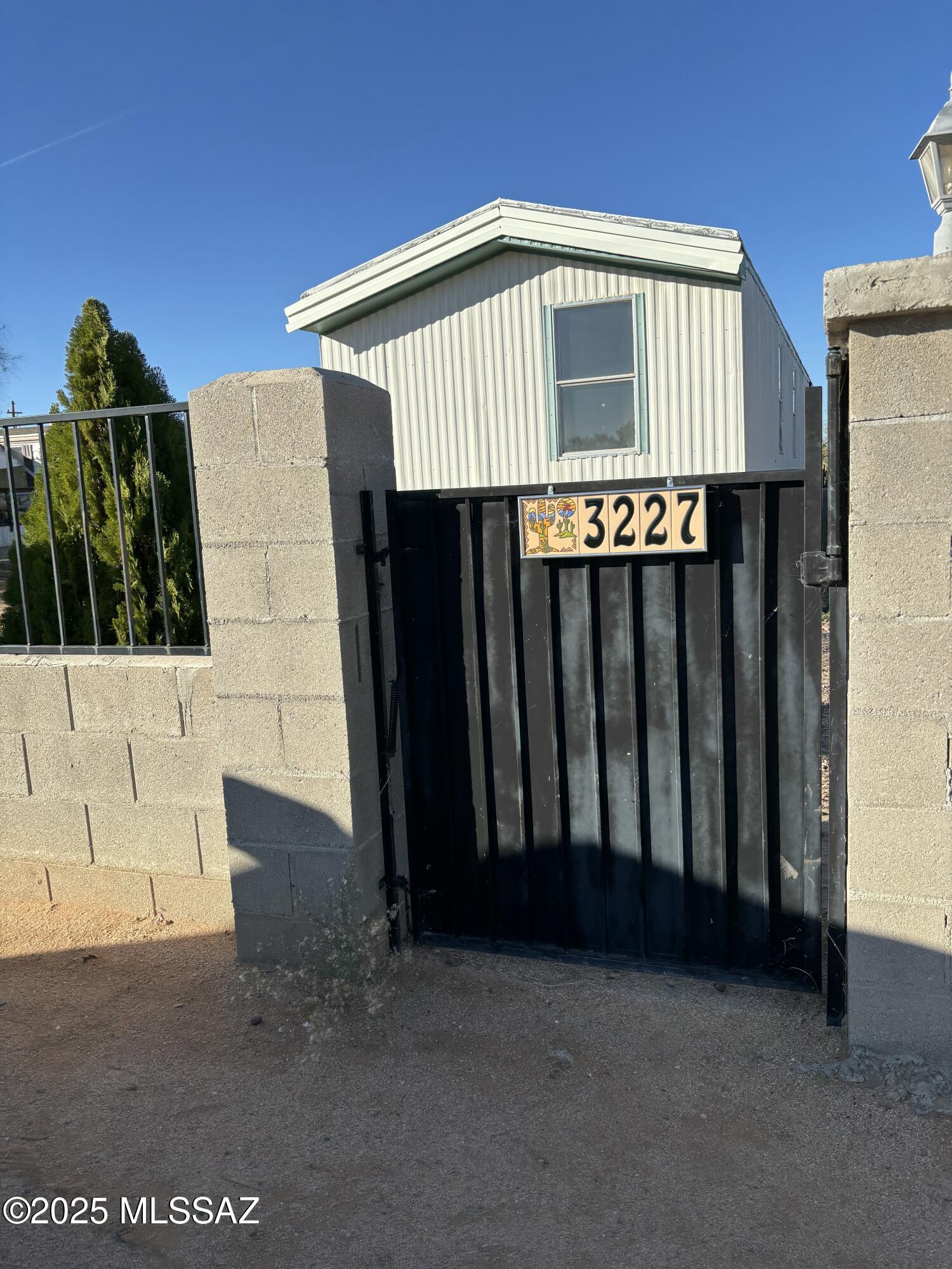 Must see this great opportunity to own with views of the Catalinas! Very quaint parcel includes a 900+ sq ft manufactured home with 3 bedrooms and 2 baths, a large new spacious front porch, a double gate for your Toys! No HOA!! This property has endless possibilities for what you can create with some TLC. Priced to sell ''as is'', come see and make an offer today before this property is gone. You'll be walking minutes away from the Catalina Community Center, which includes a community pool, and minutes away from the beautiful Catalina Neighborhood Park, where you can enjoy views, a game of basketball, playground equipment, ramadas and so much more.