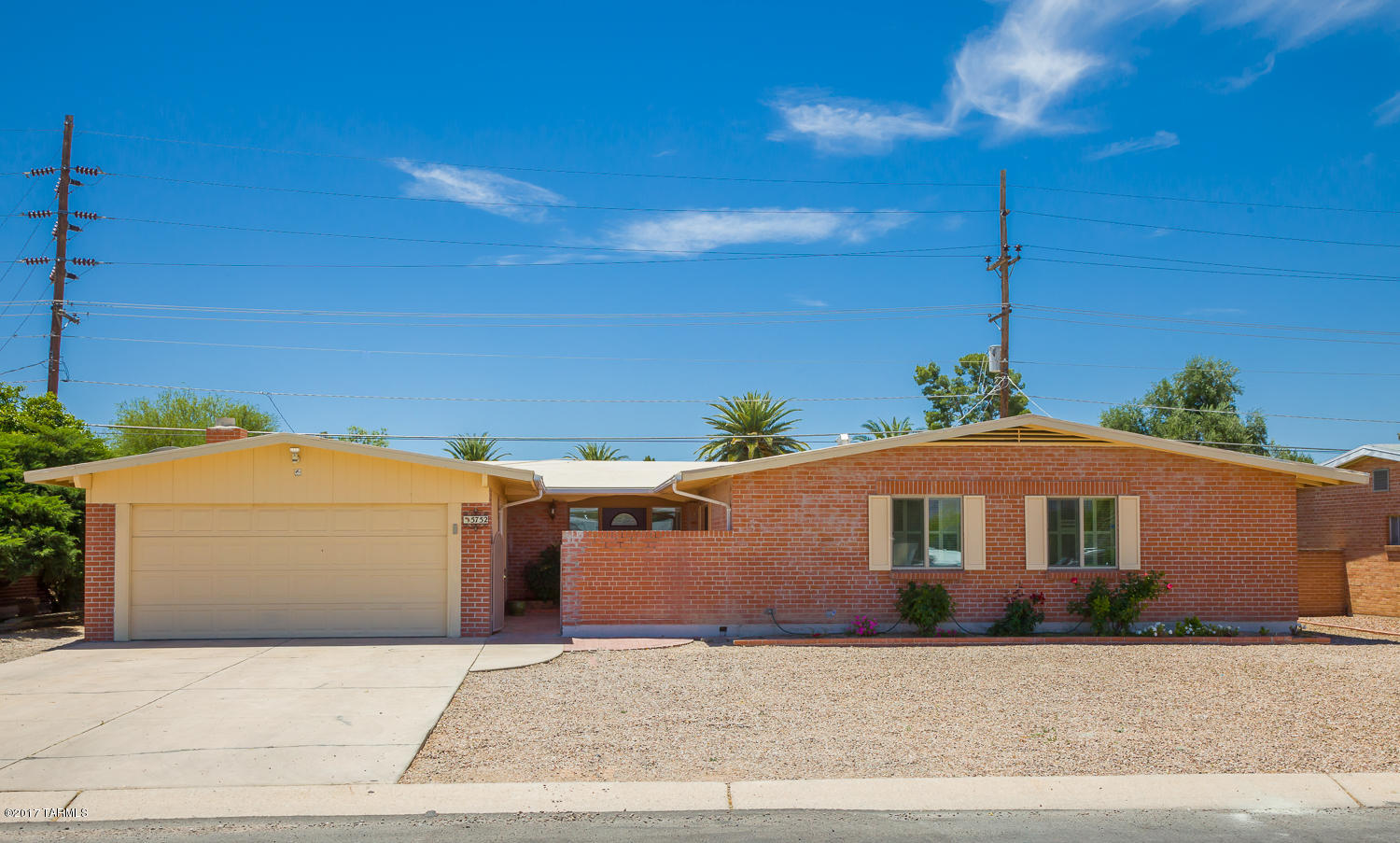 Move in ready, Central 3BR/2B home. Front mountain views! Spacious remodeled kitchen, great for entertaining with like new appliances.  Extra large family room with fireplace plus formal living room and dining area.  Brick with covered patios in front & back. Private walled backyard w/ pool and southern exposure. Large 2 car garage. Close to Trader Joe's, TMC, Costco, Target, bus lines, etc.
This is an absolute fabulous neighborhood, don't miss this brick covered beauty.