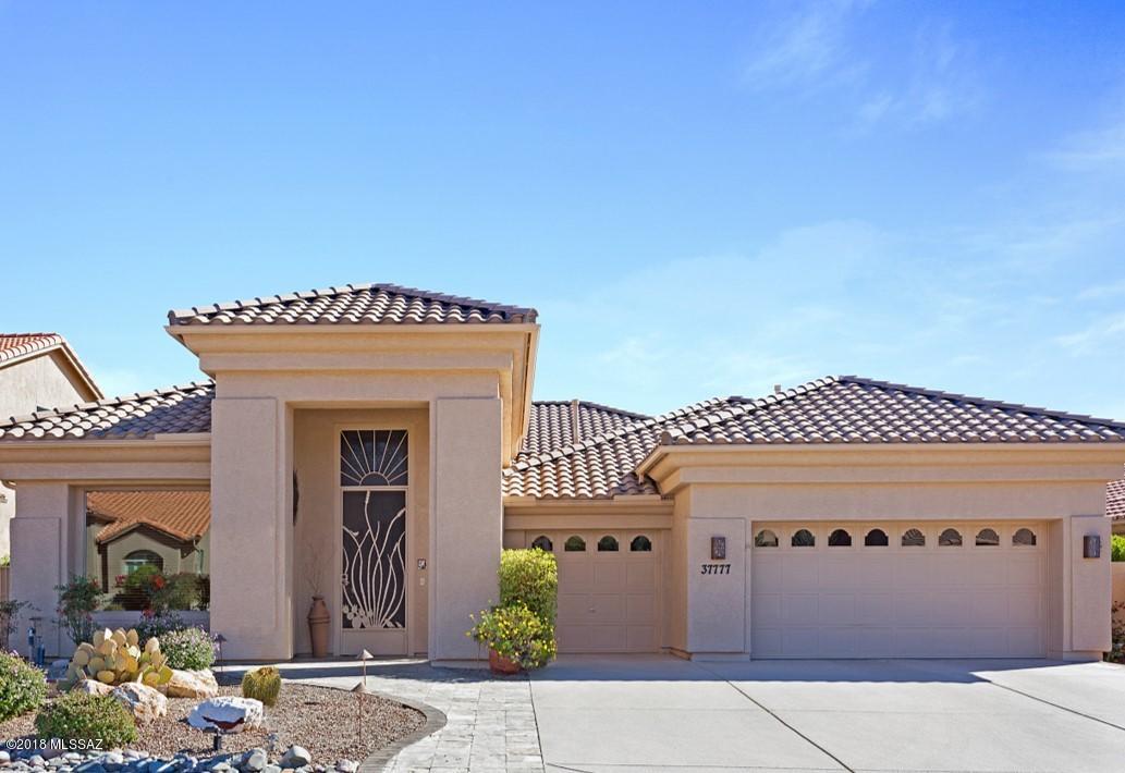 Beautiful 1-story home in Tucson's premier 40+ active-adult community of SaddleBrooke w/ breathtaking views of the East Catalina Mountains. Home is situated on a hill overlooking the 16th hole of Mountain View golf course. Stunning views can be seen from every rear window. Gorgeous landscape is complimented by a sparkling pool w/ water feature, tiled patio, & outdoor gas fireplace. Spacious 3 bdrm floor plan also has a study, formal living & dining, & built-in bar area perfect for entertaining! Open kitchen boasts 42'' cherry cabinetry w/ pantry & pullouts, granite counter tops, gas cook top, island, under cabinet lighting,& reverse osmosis system. 3-car garage w/ workbench & space for your golf cart. Just a short ride to the clubhouse for lunch at Mesquite Grill or a game of tennis & golf