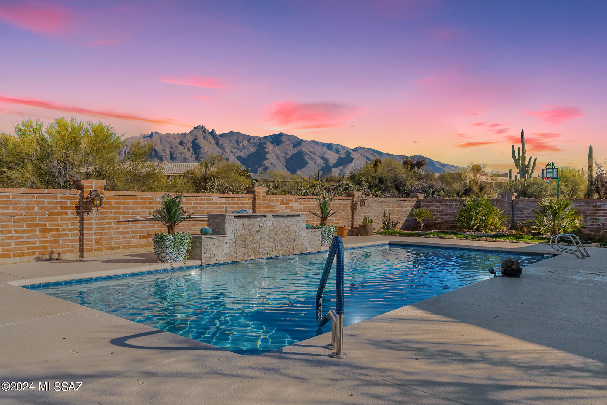 Nestled in the heart of the Foothills, this exquisite updated and remodeled 5-bedroom 5-bathroom home boasts unparallelled view of the majestic Catalina Mountains located on a cul-de-sac, large lot, offers a luxurious and serene living experience with guest quarters. A true haven for those seeking both sophistication and comfort, showcasing the many updates and thoughtful design. The neutral colors and spaciousness created an atmosphere of timeless charm. Beam ceilings, new fixtures throughout. Solar panels and two Tesla batteries make this home very energy efficient. The back yard offers privacy , views and the best way for enjoying outdoor living.