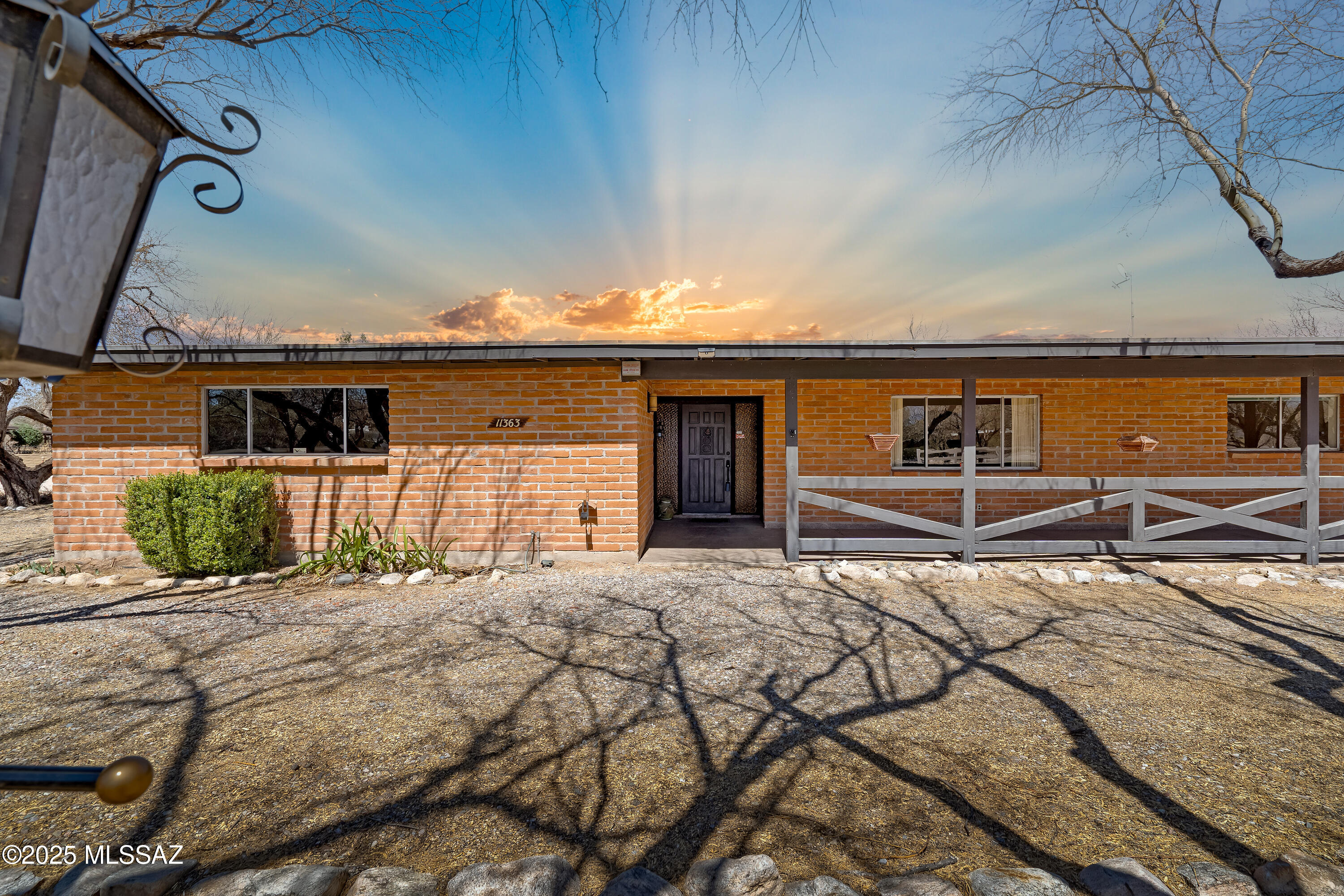 Located in highly desirable Bel Air Ranch Estates, this stunning ranch-style home seamlessly blends comfort, retro style & breathtaking views. Inside you'll find a classic living room, cozy family room w/beamed ceilings & rustic brick fireplace adding warmth & charm. Efficient galley kitchen offers functional space for prep & cooking w/extra large pantry for tons of storage! Enjoy sweeping Catalina Mtn views from the backyard where you can relax on the spacious ext'd covered patio or take a dip in the sparkling pool. Equestrian enthusiasts will appreciate the horse facilities, arena, tack room & RV carport. Whether hosting guests or relaxing w/family, this ranch home offers the ideal space for all your toys & fun! Property sold AS-IS -seller will make no repairs. Opportunity awaits!