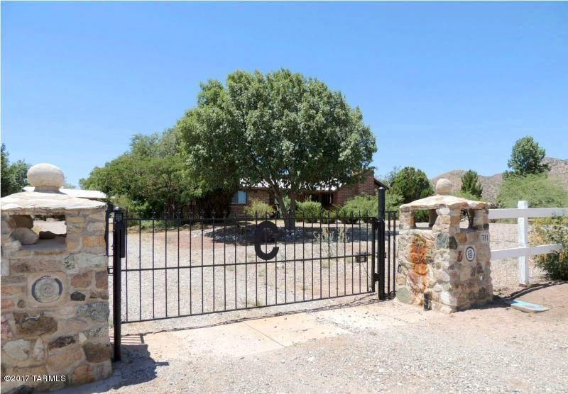 NEW ROOF in January, 2014!!  Main House and 2-Car Garage - Cost $10,000. Outbuildings & porches re-coated - Cost $3,000  Highly sought after location.  Cochise Stronghold is just to the West.  This brick home was built to last for generations to come.  Beautiful upgraded 3 bed/3 bath home with attached guest quarters that has a full kitchen & breakfast bar with it's own private enclosed patio & separate entrance.  It's the perfect Mother-in-Law space. Built-in spa in separate room with Pella windows, porch, rock patio, custom rock fence and so much more.  The 5 acres is fenced & cross-fenced, so it's perfect for HORSES or other livestock. Get out of the city and enjoy the quiet serenity of living in the county!