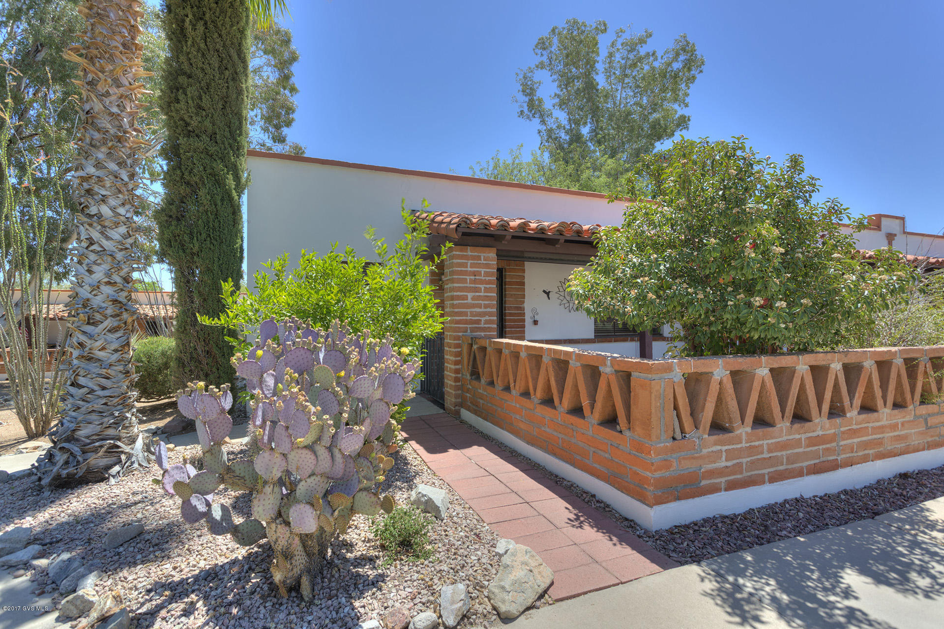 Sits right on Paseo Cerro. Parking in front. Updated and extended 2 bedroom villa. Washer/dryer included. Tile except for bedrooms. Homeowner's association dues include garbage pick-up, exterior pest control, termite control, building exterior maintenance, common area grounds, roof, heating, cooling, water heaters, water, sewer, recreational/pool facilities and laundry facilities.