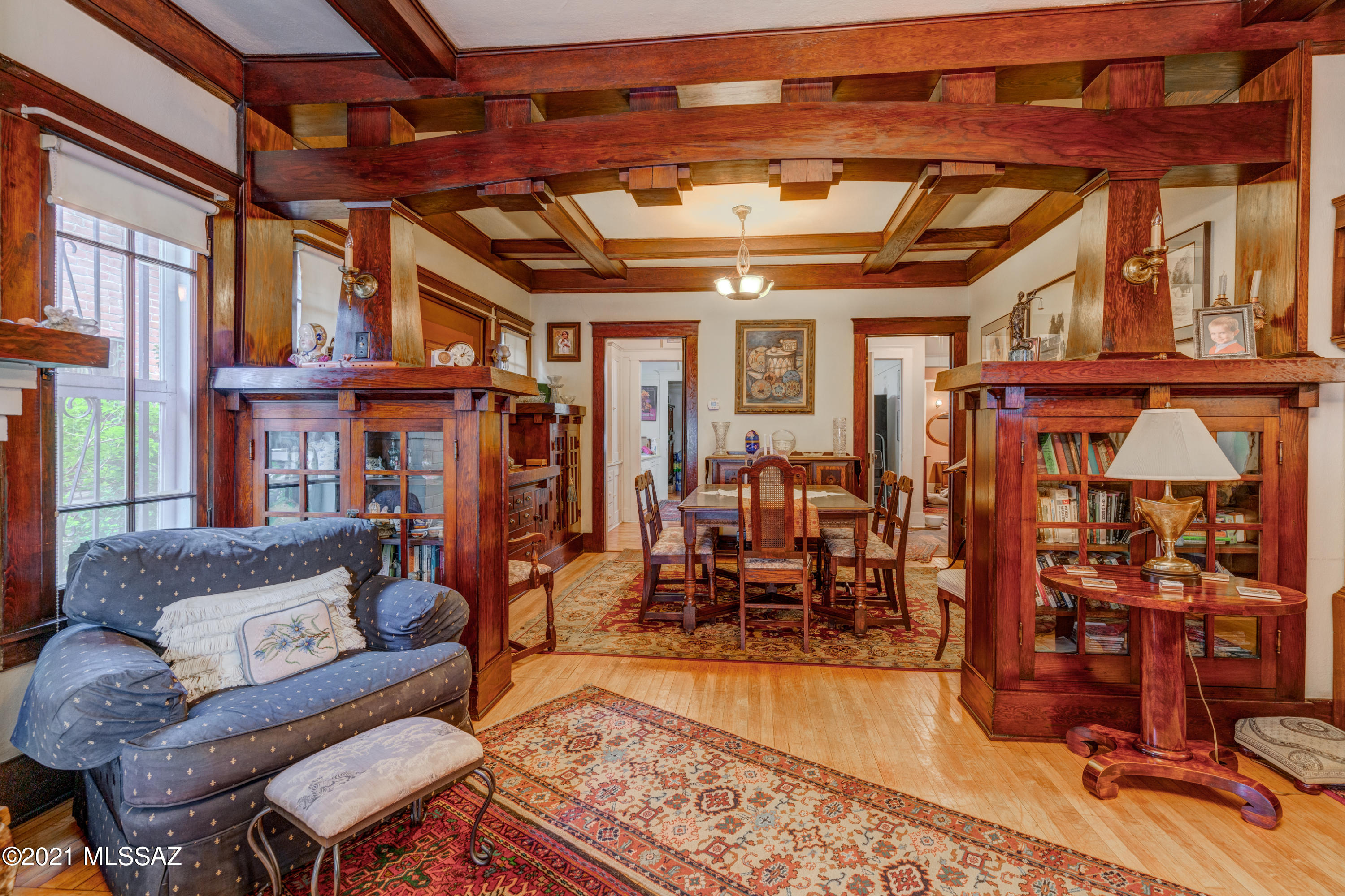 This Historic Registered craftsman home has been in the family for over 100 years. Beautiful intricate wood beams, built in books cases, dining hutch and buffet, and door frames all carved from same wood. Ash hard wood floors. 3 bed/ 2bth. Front porch with swing, basement for storage. Large back yard with garage. Zoned R2 in Tucson downtown historical district. Walking distance to downtown, museum, market district, and Gem and Mineral show prime location.