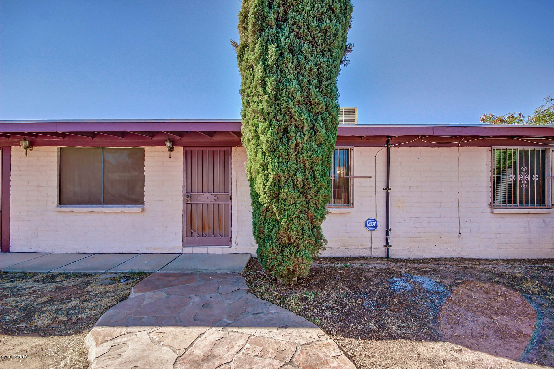 Charming Ranch Style Home with 3 bedrooms, 2 bathrooms, and spacious open floor plan. Carpet & tile flooring, window blinds, decorative security doors, and soaring ceilings. Large eat-in kitchen features black appliances and plenty of wood cabinets. Laundry room with storage cabinet. Updated bathrooms with tiled bath surrounds and pedestal sink. Huge backyard with sparkling fenced pool, covered patio, stately Cypress trees, and Ramada area. Bring your imagination and creativity to make this Home your own! Home is being sold as-is, please include as-is addendum when submitting an offer. No SPDS or CLUE will be provided as this is a foreclosure sale.