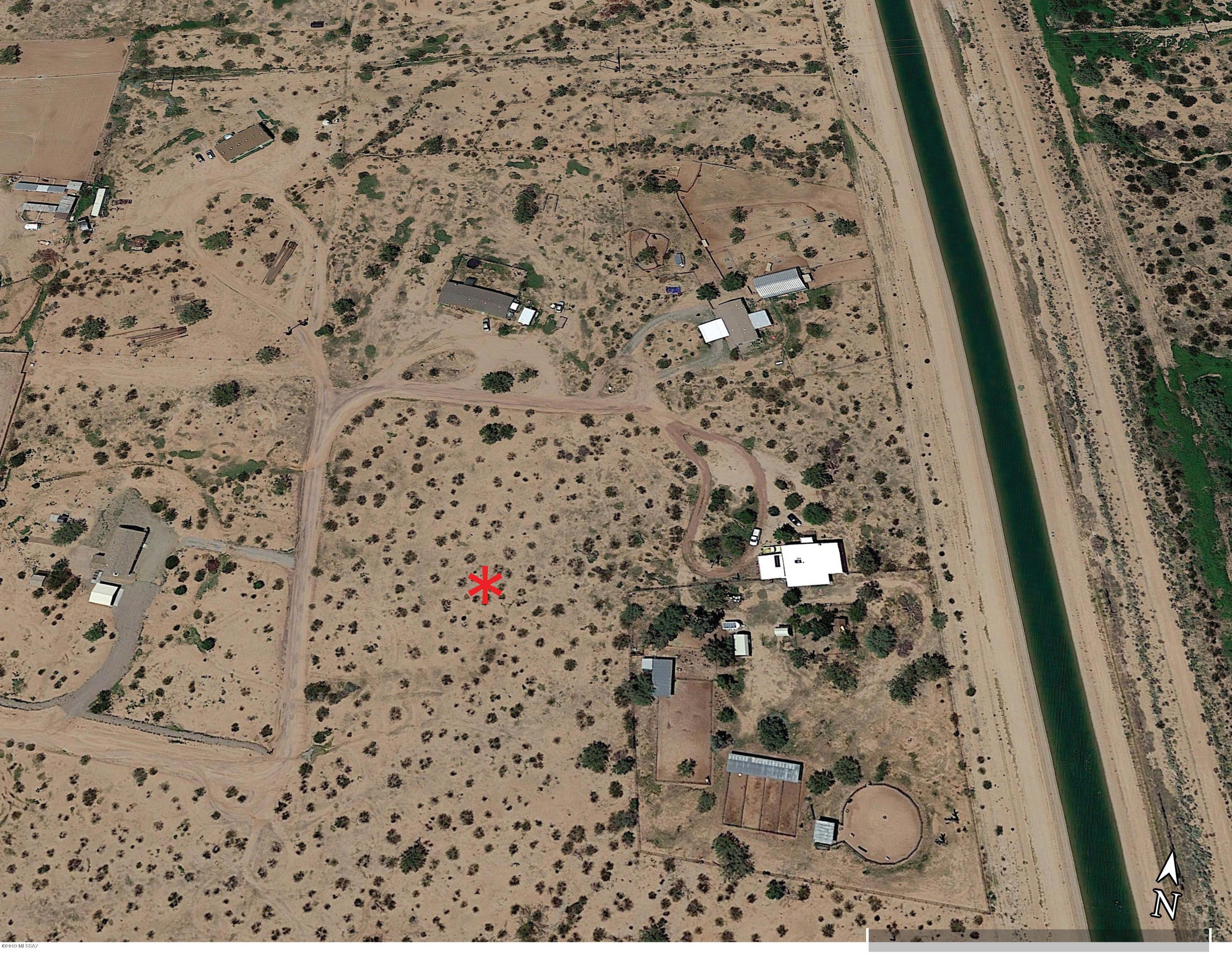 Enjoy 3.3 acres of Horse property that backs up to state land. This property is great for toys & horses with easy quick access to riding trails, and family living.  There is a shared well and the electric transformer is located at the NE corner per Trico. This Desirable location in growing area of Pinal County is 15 minutes away from Marana exit 236 at 1-10 with growing amenities and business (McDonalds, Jack in the Box, etc.). So Leave the HOA behind!!  PLEASE CONTACT MICHELLE GOSS FOR ALL QUESTIONS & OFFERS.