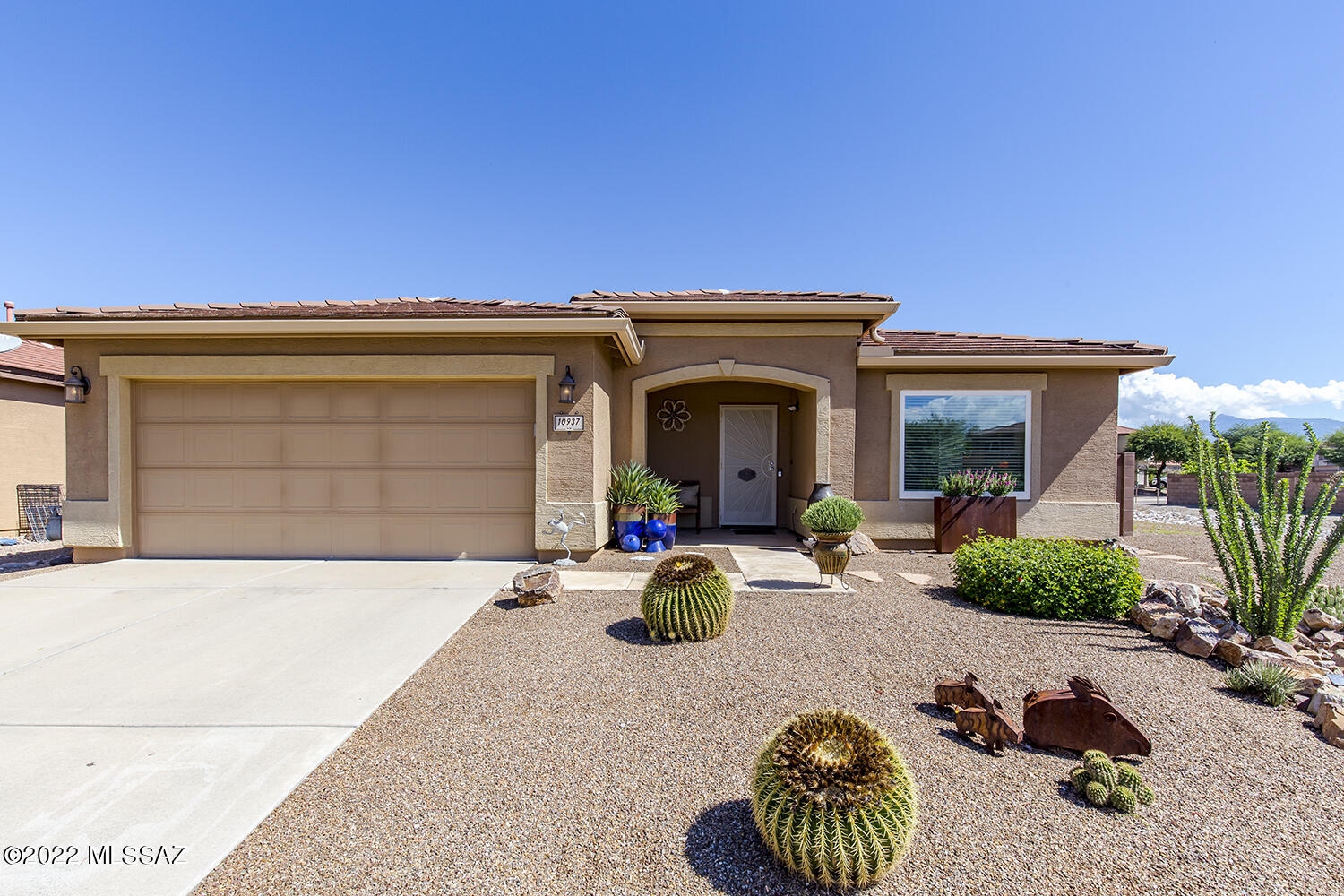 Huge price improvement! With pride of ownership and updates galore, this 3 bedroom plus Den, 2 bathroom home is perfect for the most detailed oriented buyer. Kitchen updates include double ovens, pullout shelves stainless steel appliances, Corian counters and glass front cabinet doors. Both bathrooms have been remodeled. Primary en-suite has two showers for ultimate convenience. Large laundry room, walk-in primary closet and garage cabinets.  All windows have been replaced and water softener has been installed. Peace of mind will come along with the recently replaced water heater and heating/cooling system. Prepare to relax in the expansive backyard, Ramada or spa to watch the stars. Kitchen appliances, extra freezer, washer/dryer & storage shed included in sale.Don't miss this gem!