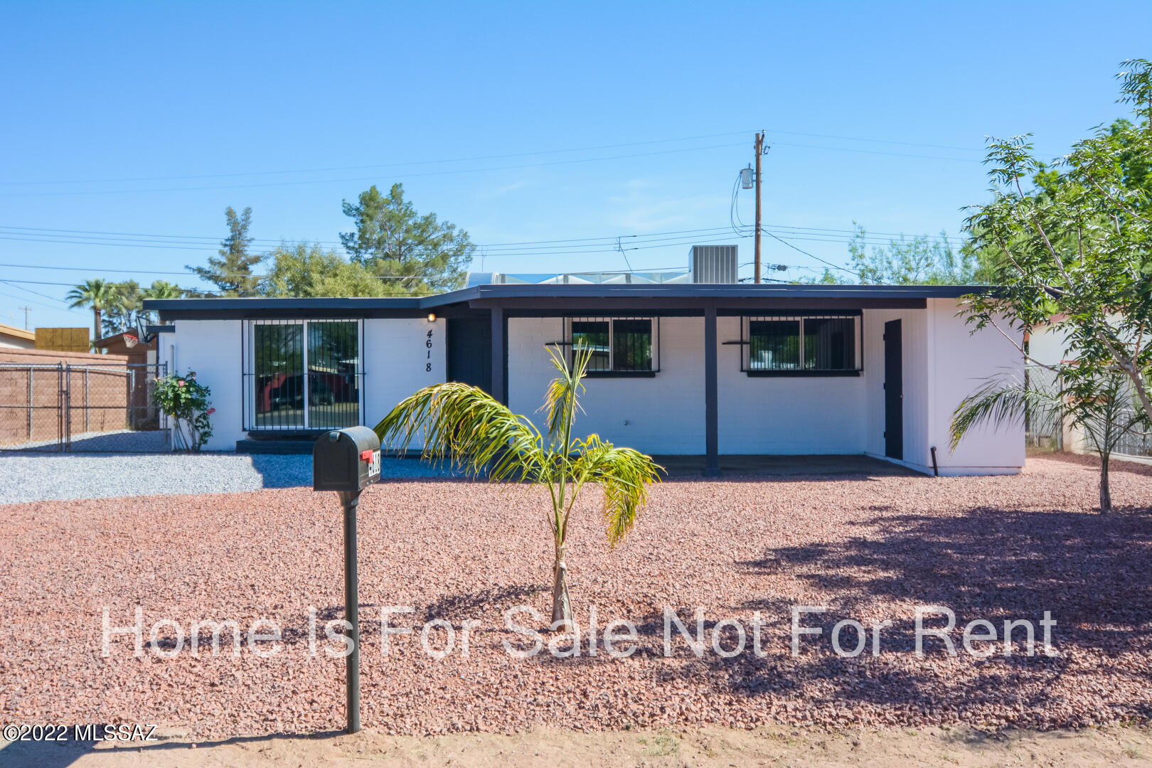 Vacant, sanitized and beautifully remodeled Ranch style home. Located in a convenient South Central Tucson location. Charming block construction. Rich wood look LVP flooring. Updated kitchen with stainless steel appliances. New custom interior and exterior paint. Fenced back yard with dual storage shed/workshop. Upgraded door hardware and light fixtures. Dual pane windows. Mature vegetation. Professionally landscaped front yard. One car carport. No HOA. This home shows beautifully.