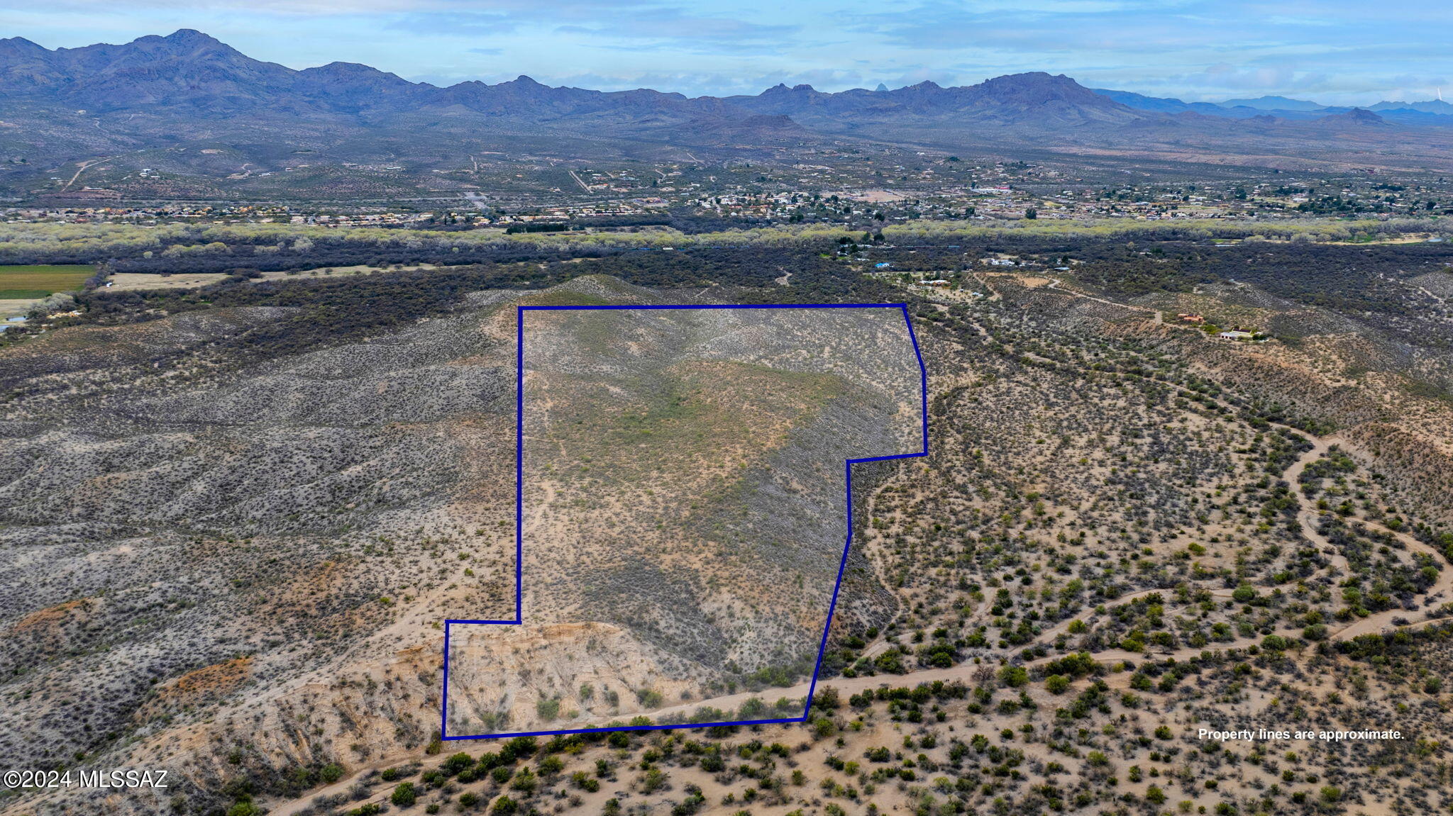 Discover the magic of TBD Clark Crossing Rd, a sprawling 60-acre canvas in Tubac Ranch Estates, AZ. This desert gem beckons dreamers to sculpt a haven within the heart of the Sonoran Desert. Embrace the allure of Southwest living with panoramic views, offering a tranquil backdrop for a custom residence, an equestrian escape, or a personal retreat. Secluded yet connected to Tubac's cultural richness, this parcel invites you to weave your dreams into the vibrant tapestry of this prestigious community. Your 60 acres of pure potential in Tubac await - where the desert whispers and imagination soars.

vacant land on a flat hill inside the Tubac Ranch - no access