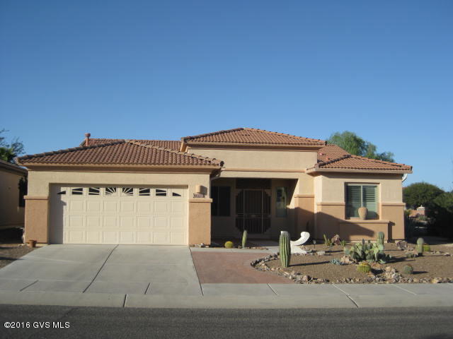 Curb appeal galore with this popular San Diego model on a large corner lot. Enter thru the double front doors and admire the gorgeous tile floors in the large great room. Open kitchen for entertaining and a wonderful screened patio.Split bedroom plan is so popular for guests. Garage has a huge amount of storage cabinets for all your toys.Den and guest bedroom have laminate and master bedroom has carpet. Don't miss out on this nice one.