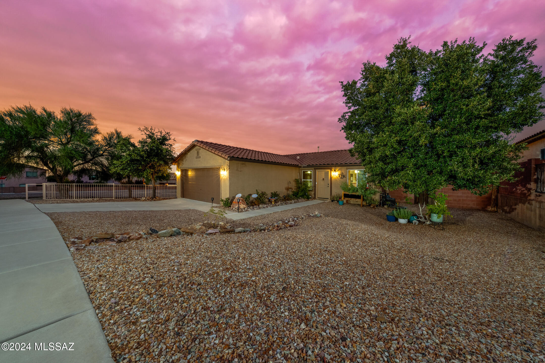 Discover comfort and style in this charming 3-bedroom, 2-bathroom home in Vail, AZ. Step into an open kitchen with ample counter space and storage, complemented by new appliances (March 2023) that come with a 3-year warranty. The primary bedroom offers a ceiling fan for added comfort, a spacious walk-in closet, and an en-suite bathroom with a shower/tub combination. The enclosed Arizona/Sunroom gives additional space is the perfect spot to relax!  Recently painted, the exterior shines with fresh curb appeal. Enjoy outdoor living in a low-maintenance backyard featuring a cozy gazebo. With a 2-car garage and all the essentials, this home is ready for you to move in and make it your own! Property has an assumable mortgage! Your next chapter starts here!