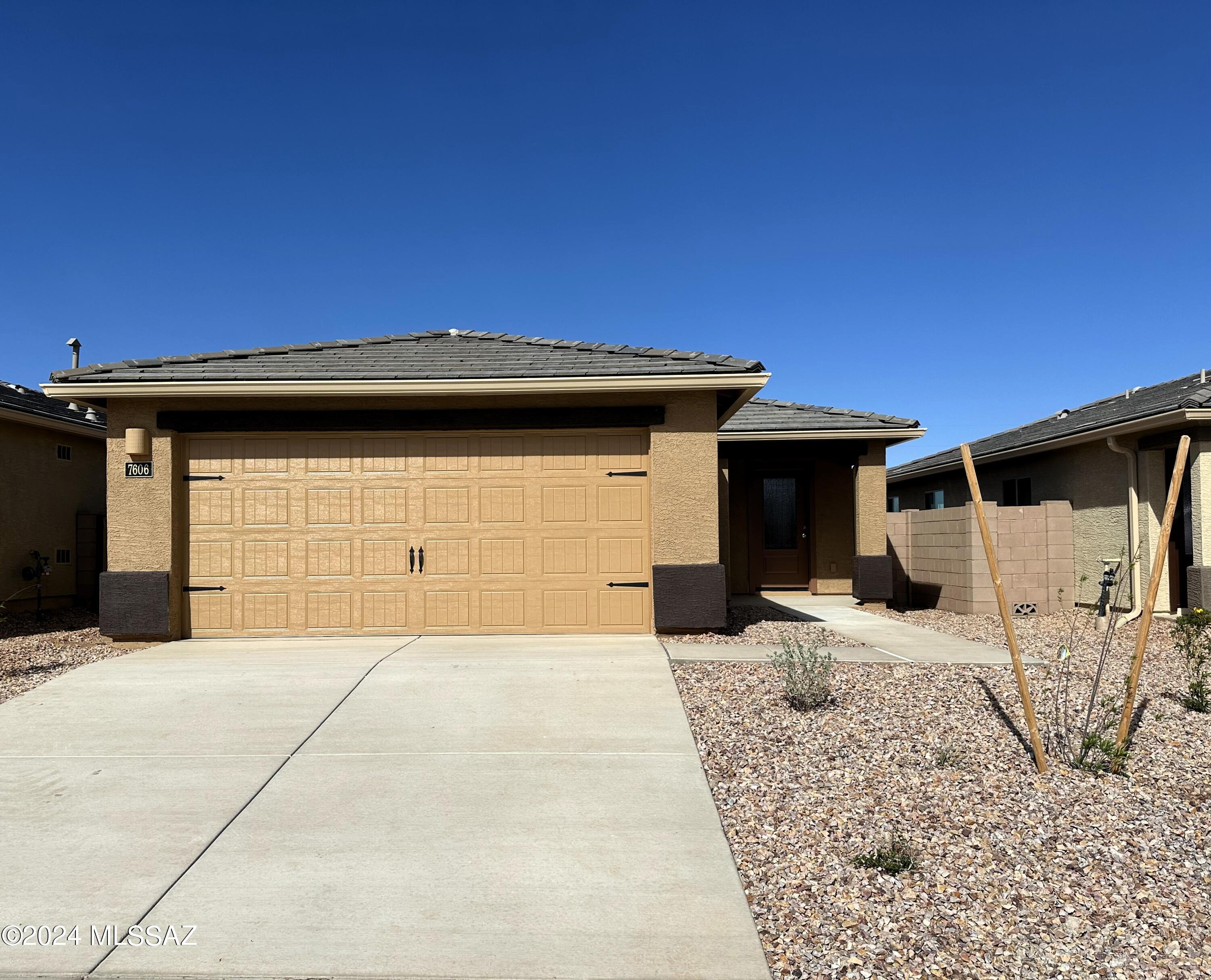 This charming 3-bedroom, 2-bathroom home defines modern comfort.  This cozy residence features a spacious great room, breakfast area, private master suite, and a 2-car garage. Additionally, enjoy views of the gorgeous Kitt Peak from the master bedroom.  

Included upgrades enhance your living experience, with energy-efficient appliances, granite countertops, wood cabinets, and more. Three bedrooms ensure everyone has their own room to spread out, with flexibility to use an extra bedroom as a guest space or home office.

Indulge in the luxury of a private master suite. The bedroom easily accommodates king-size furniture, and the walk-in closet and private bathroom provide the ultimate convenience. This home's curb appeal is a visual delight with a professionally landscaped front yard.