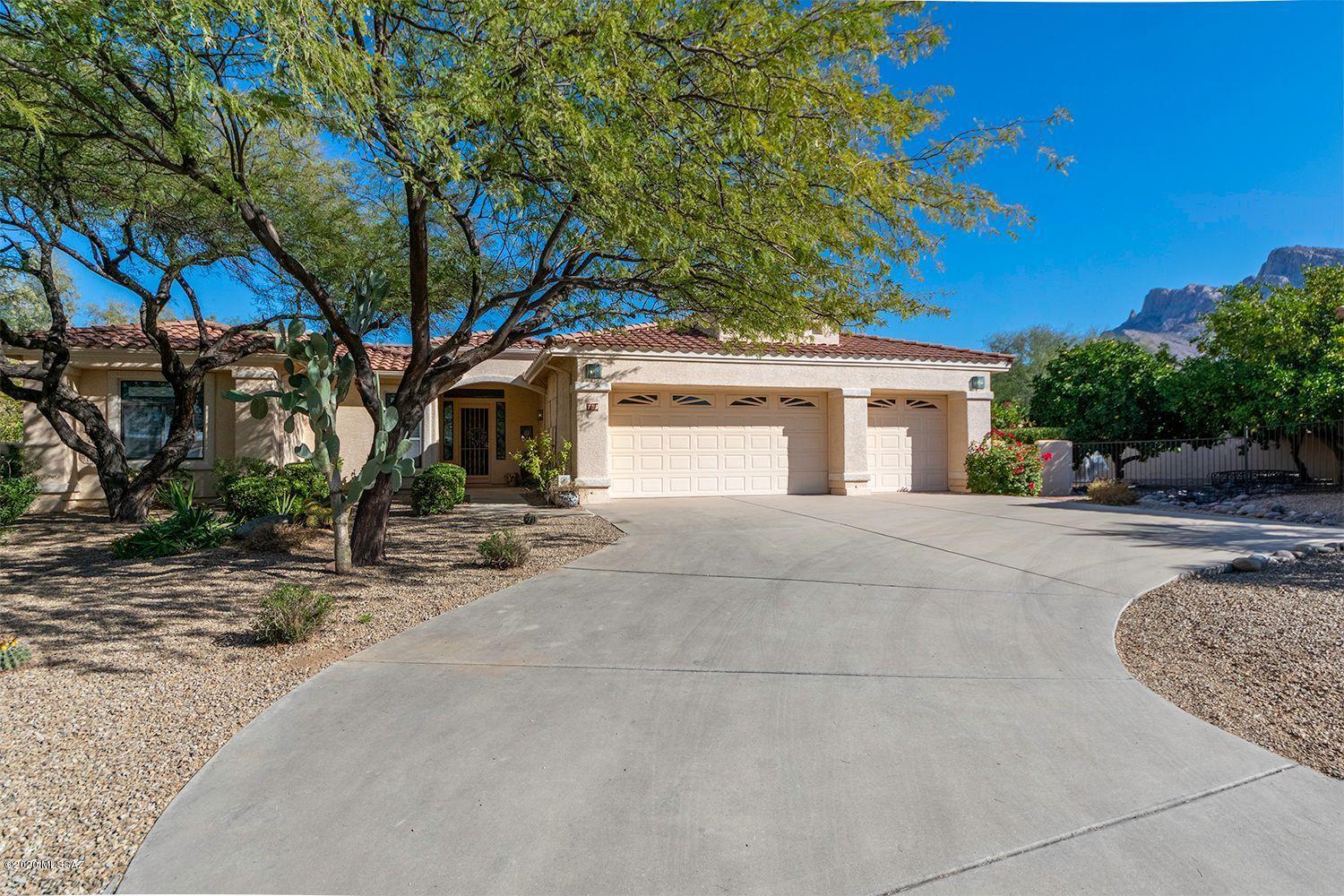 Beautiful property very close to Oro Valley CC. Home sits in the corner of a quiet cul-de-sac with mountain views. Pool, spa, 3-car garage with separate storage room, plantation shutters throughout, 2 fireplaces (family room & master bedroom). 2 full bathrooms. Formal dining room. Water softener. Citrus trees fill the private, shady side yard. Small, gated subdivision features community pool & spa, and sidewalks - only 1/4 mile to James Kriegh Park and the O.V. Aquatic Center.