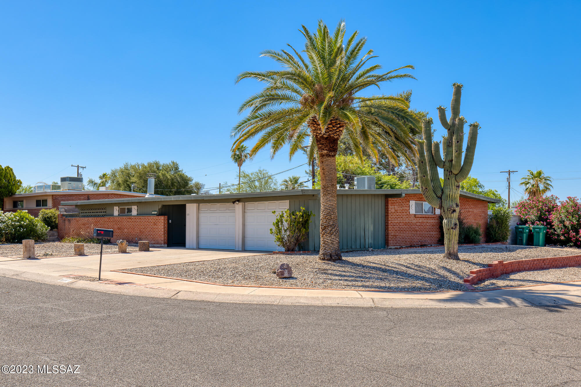 Desirable 3 bedroom 3 bath getaway on a corner lot with pool in this well cared for Orange Grove Valley home! Double brick construction provides energy efficiency and noise reduction. This home features several improvements, such as enclosing the carport to a two car garage, adding RV parking, and enclosing the patio for more living space. This space also features dedicated min-split cooling making it perfect for a home office setup. Saltillo tile and hardwood throughout. Wood burning beehive fireplace. Enjoy the sanctuary of the backyard with eco friendly turf, a refreshing pool that is fully fenced, and still have ample space in the rear yard for storage or toys of your choice. Close proximity to lots of shopping and recreation. Come see your new home today!
