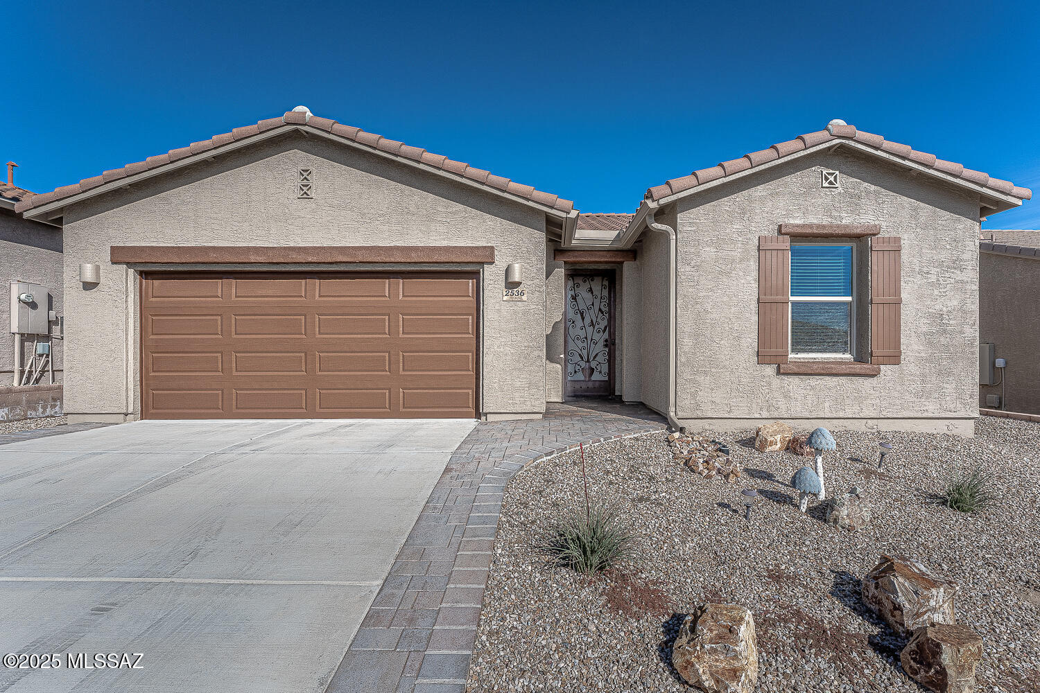 Want to live in coveted Canoa Ranch?  This is your chance with one of the newer homes in this gated Bassett Peak community!  Gracious GreatRoom with open kitchen..perfect for entertaining while talking to your guests.  Split bedroom plan so your company will have their own side of the house!  Stainless steel kitchen with pantry closet and gas range.  Quartz countertops and an island/ breakfast bar!  Huge walk-in closet in primary bedroom plus double sink vanity.  Large bright 2 car garage.  Covered patio with decorative cement tiles leads to spacious walled backyard.  Nearby Green Valley Rec facilities include pickleball courts, indoor/outdoor pool, fitness center, basketball court.  Nearby Canoa Golf Course for the golfer in the family.  Furnishings are included in this fine home.