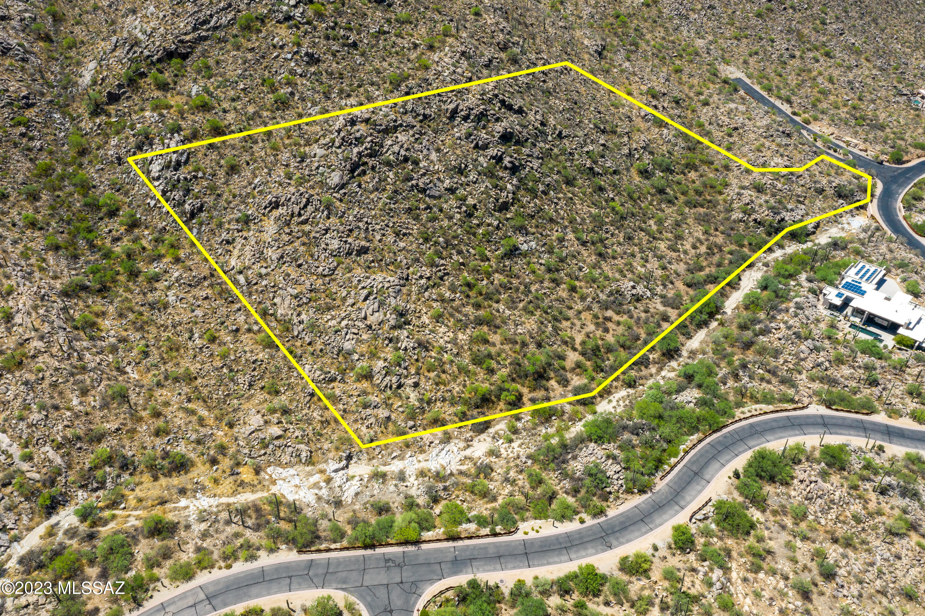 Mesmerizing location and views at this over 4 acre custom lot in Canyon Pass at Dove Mountain. Outstanding location within the subdivision on a corner - elevated lot - very spacious building envelope - lush desert landscape studded with saguaros, rock out-croppings.  Wonderful canyon views - panoramic vistas - sunsets that will awe.  Great value for this very large, very private custom lot.