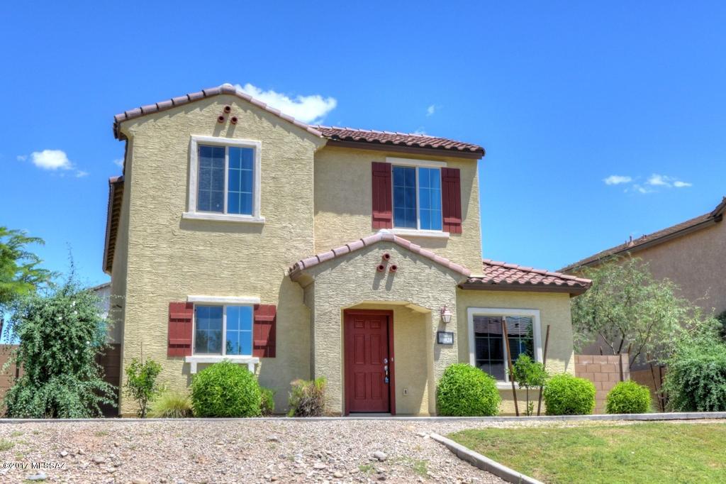 Beautiful 3Bdrm/2Bath, Two Story Home in desirable Sierra Morado community. Downstairs with open Great room. Tile/Carpet flooring. Nice kitchen w/large center island off dining area. Half bath downstairs. All Bedrooms upstairs, Master with large walk in closet. Washer/Dryer hook-up, 2 Car Garage, Low care landscape with block wall. Community features are community pool, rec center, basketball courts, dog park, walking paths & parks. Vail School District.  (Houghton/Drexel)