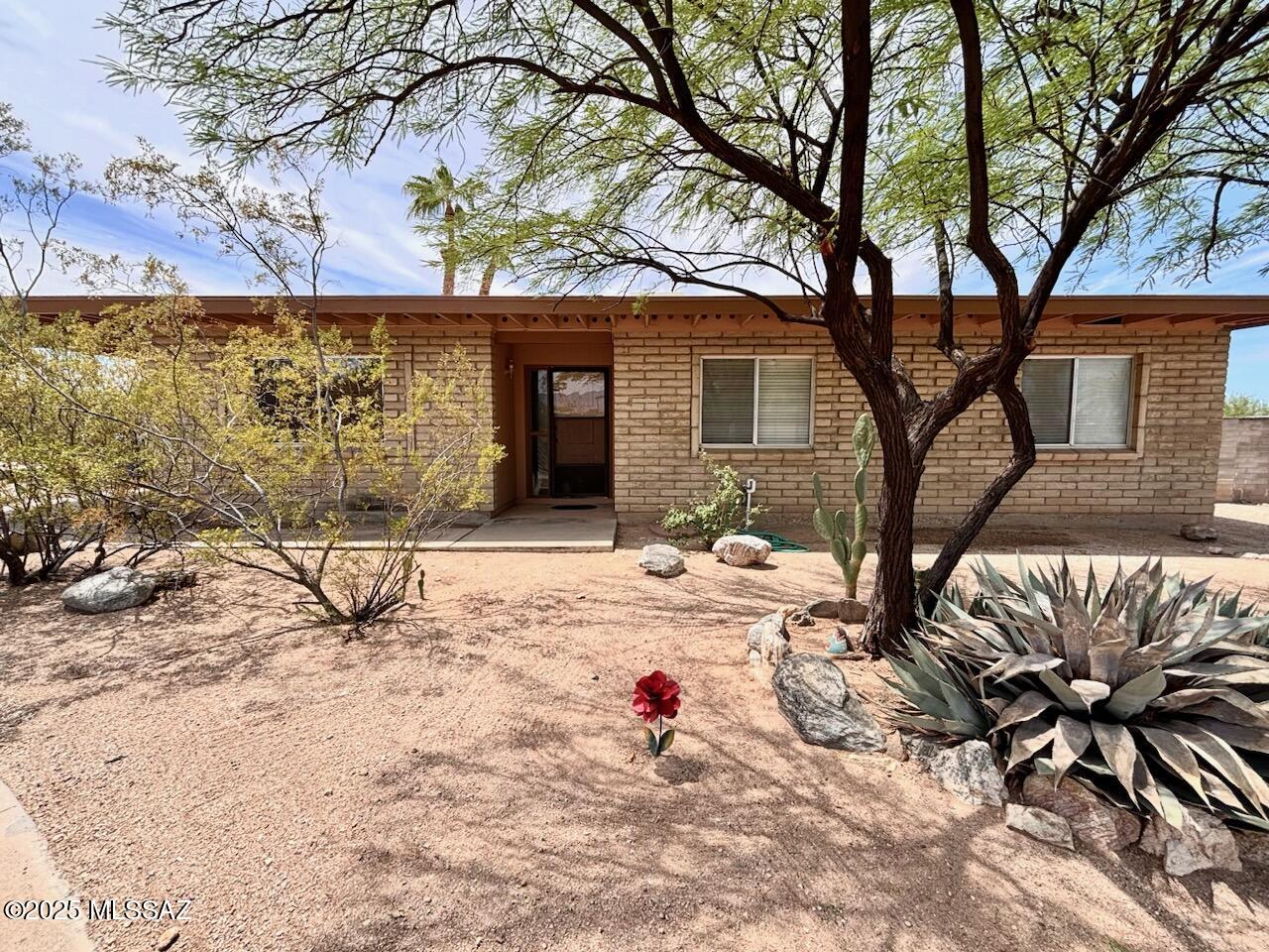 Lovely Ranch style 4BD, 2BA home on large lot in established neighborhood.  Remodeled kitchen, dark wood cabinets, granite counter tops and walk in pantry.  Cozy brick fireplace, skylights for natural light and new paint and ceiling fans throughout. Spacious master bedroom with new laminate flooring and walk in closet. Large low care backyard, extended covered patio, double gates, RV parking and spacious laundry room/workshop. Roof recently coated, no HOA and new heat pump (cooling/heating system). Great location and move in ready!