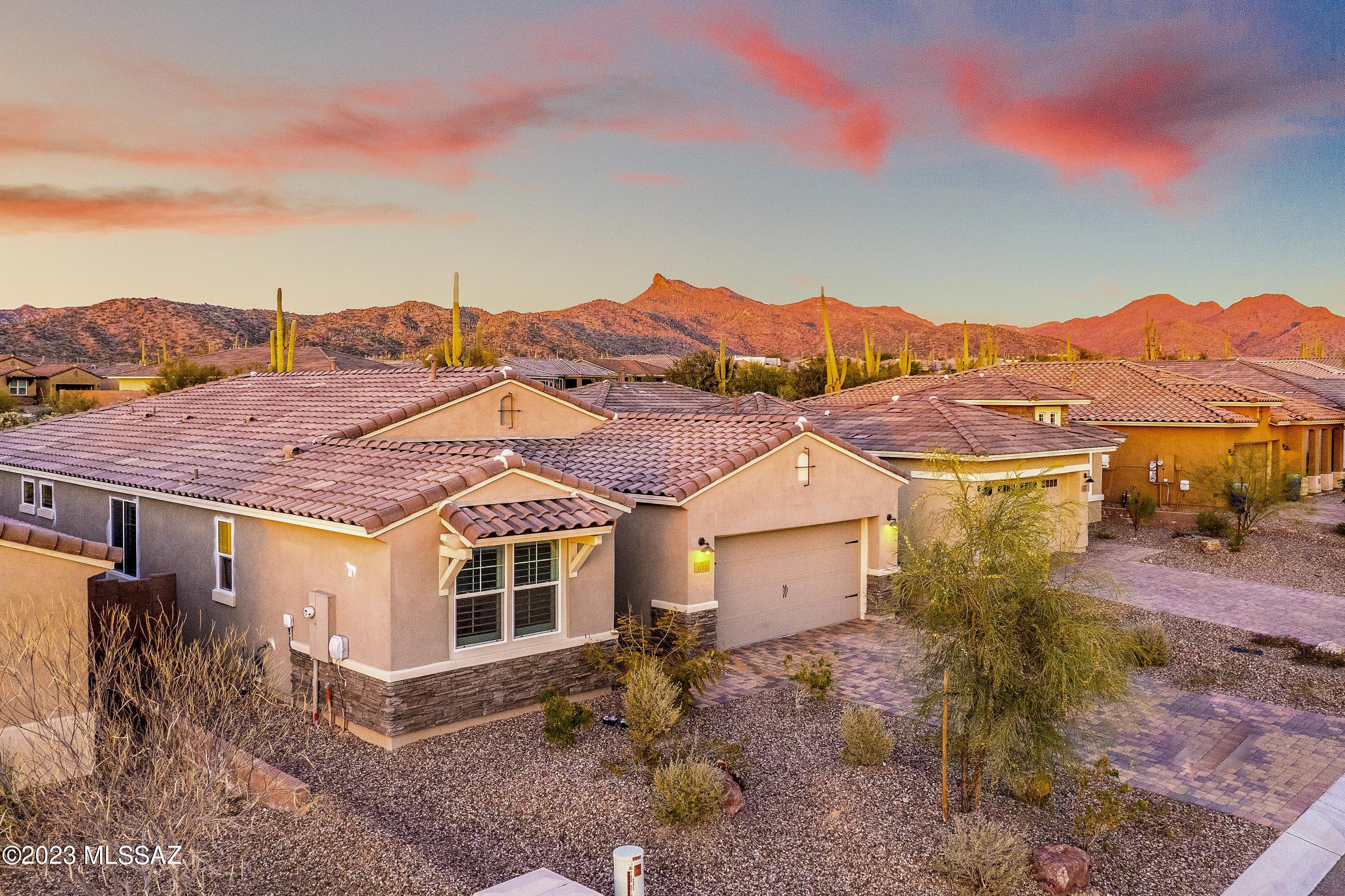 MASSIVE Price Improvement!!! Seller says sell it!
This home is BETTER than new. This home is fully complete and a rare Mattamy Homes Sycamore floor plan which is no longer available to build!
 Featuring a gorgeous extensive island in kitchen, gourmet finishes and stunning white cabinets with hardware. Back yard has vacant common space of natural desert and some mountain views behind for extra privacy. Oversized garage is 2 1/2 car with full epoxy finish throughout. Backyard currently unfinished, but leaves plenty of room for your imagination to fit pool, turf or other designs. Gated Blue Agave community is truly a hidden gem! Located close to The Gallery golf club and Gym, and close to shopping, but away from the hustle! Call today for a showing!