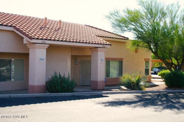 ATTN AGENTS: You must see AGENT REMARKS for additional conditions.** Renovated 2BR/2BA ALL AGES townhome that looks like new!. When comparing to other units on property, please note that this unit offers 100% FINANCING AND UP TO 6% SELLER PAID CLOSING COSTS FOR APPROVED, PRIMARY RESIDENCE HOME BUYERS. This PREMIUM LOCATION backs up to an arroyo for complete privacy and the back patio on this unit has been recently screened in to provide extra living space! Open floor plan with 9' CEILINGS and loads of windows and natural light. New flooring, ceiling fans and paint. Split bedrooms, both with walk-in closets. All appliances including microwave and a BRAND NEW washer and dryer! Beautiful community pool and spa for residents only. Easy access to I-19 and Tucson. Perfect for  young professionals or Winter visitors. Green Valley Recreation is optional. As an investment, these townhomes can't be beat, as they rent consistently with a 12 month lease. *Photos shown are of one unit in the subdivision and may not be of the unit listed. Slight variations may exist depending on the upgrades.