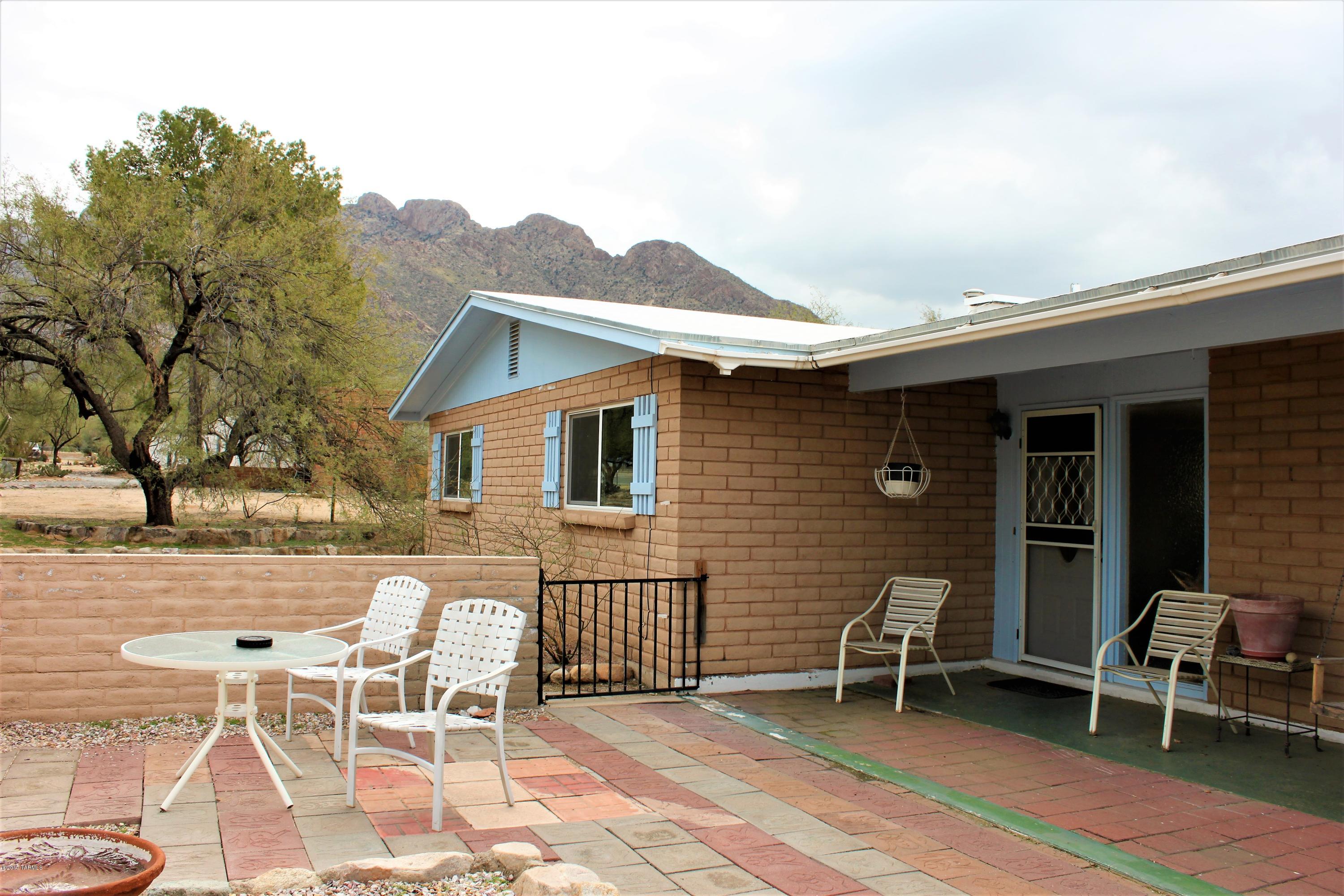 A fantastic 3 Bed/2 bath home on nearly 1 acre in the very desirable Shadow Mountain Estates. Beautiful mountain views and perfectly north/south exposure. Home has had all flooring updated to ceramic Tile. Home is very well maintained and features and open great room concept. 4th bedroom was converted to enlarge the living space and can easily be converted back, if so desire. Large over sized 2 car garage with storage and workshop area. Plus an additional 150 SQ. FT. room, for office or more storage. Additional 2 car carport on property, as well. Large covered patio and Huge fire pit out back. This is truly a must see!!!