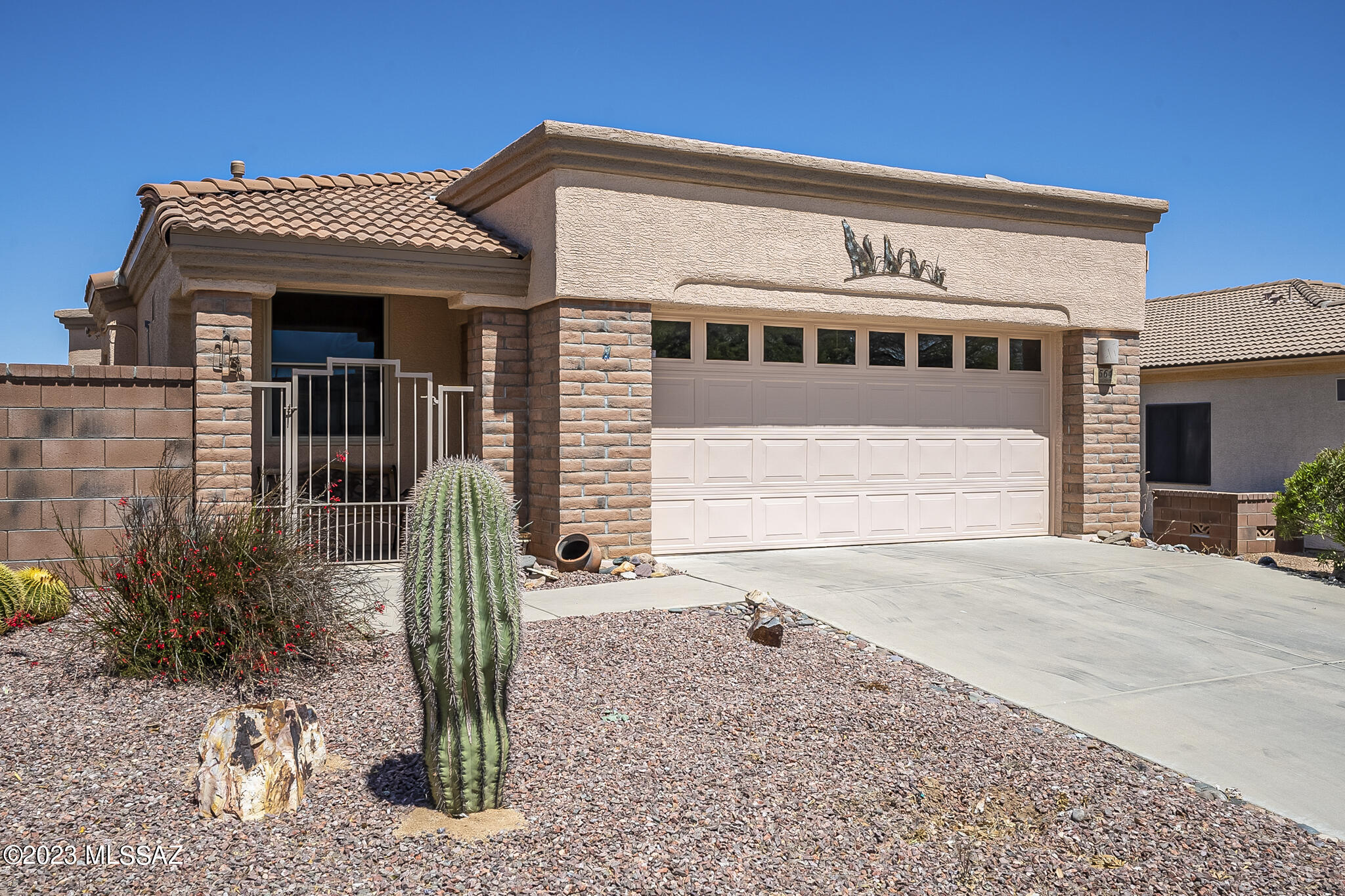A delightful house in Las Campanas within just a few blocks from the Recreation Center.  Walk through the front courtyard to find a screened breezeway which provides both privacy and cool air to move through the home.  Enter into the foyer and you will notice curved wall architecture, bold southwest paint colors, diagonally placed floor tile and natural light beaming through the floor to ceiling corner windows and glass patio door.  Your kitchen is equipped with a hanging pot rack, beautiful granite countertops, and stainless appliances.  The nook is the perfect place for everyday meals while more elegant dining is just around the corner from the kitchen.  The beautiful tile flooring continues throughout the owner's suite where you'll find a dual vanity bath with a center makeup station and an easy step tile shower that has seating bench and support bars.  If you like to spend time relaxing you are certainly going to appreciate the 4 season sunroom that is both heated and cooled.  Relax inside or journey out to the paver patio and  enjoy the serentity and views of natural desert behind the home -  you might even see some wildlife!