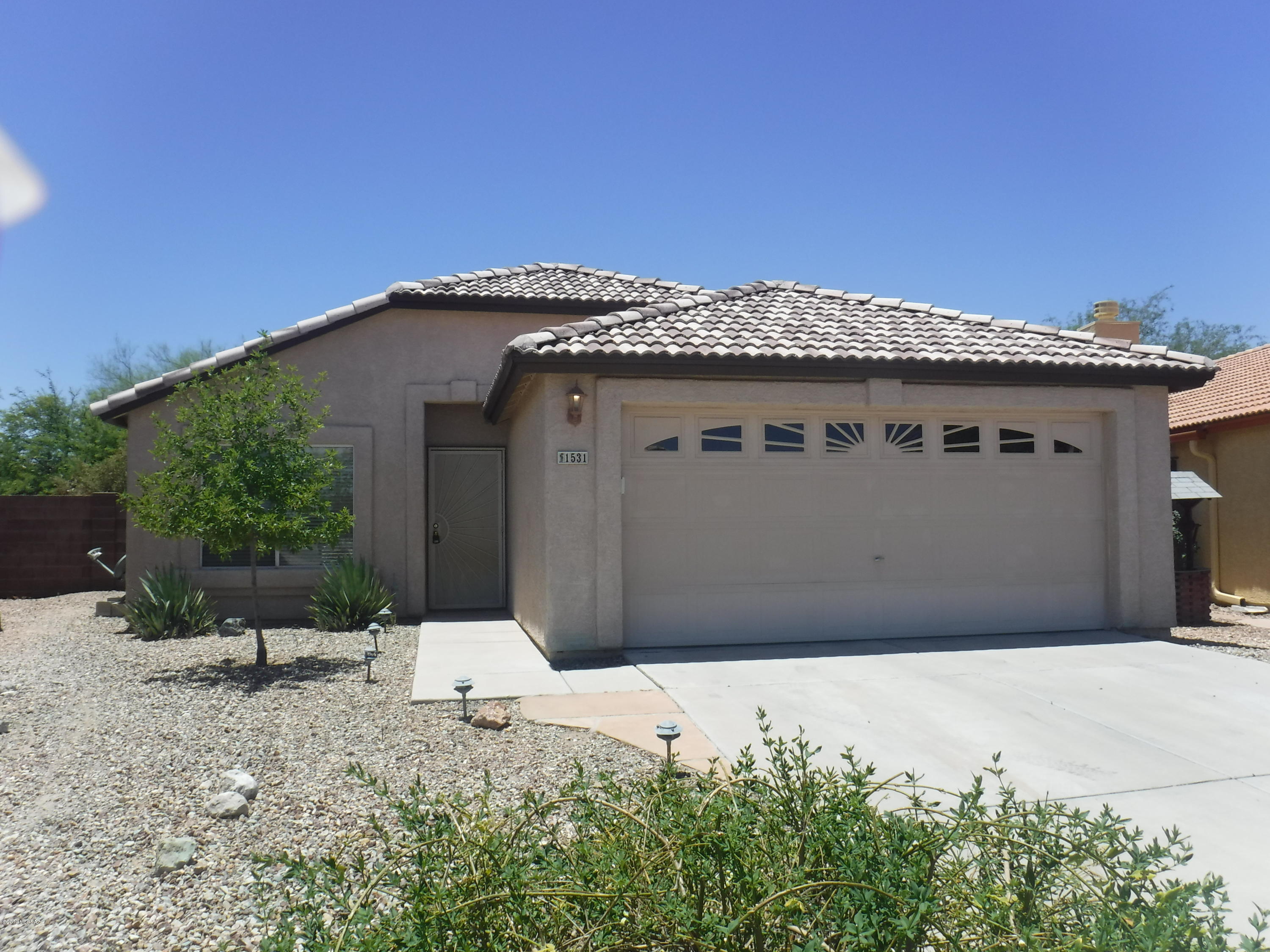 Cozy 3 bedroom 2 bath in Tucson Mountain Area tucked on end of Cul-De-Sac. Vaulted ceilings, dining, step saver kitchen includes all appliances. Expanded Main Bedroom with Nook has separate shower and Lighted Garden Tub featuring corner glass block window and built in make-up vanity mirror. Private back door to Cabana from Main Bedroom. Outside you have nice, landscaped yard, covered patio, custom ramada, and lots of privacy. Owners prefers No Pets. with pets' security deposit is $2542.50. Absolutely NO SMOKING INSIDE OR ON PROPERTY. Tenant pays rental tax if activated on property. Owner related to listing Brokers. Minor repairs are in progress to be completed in about 10 days.