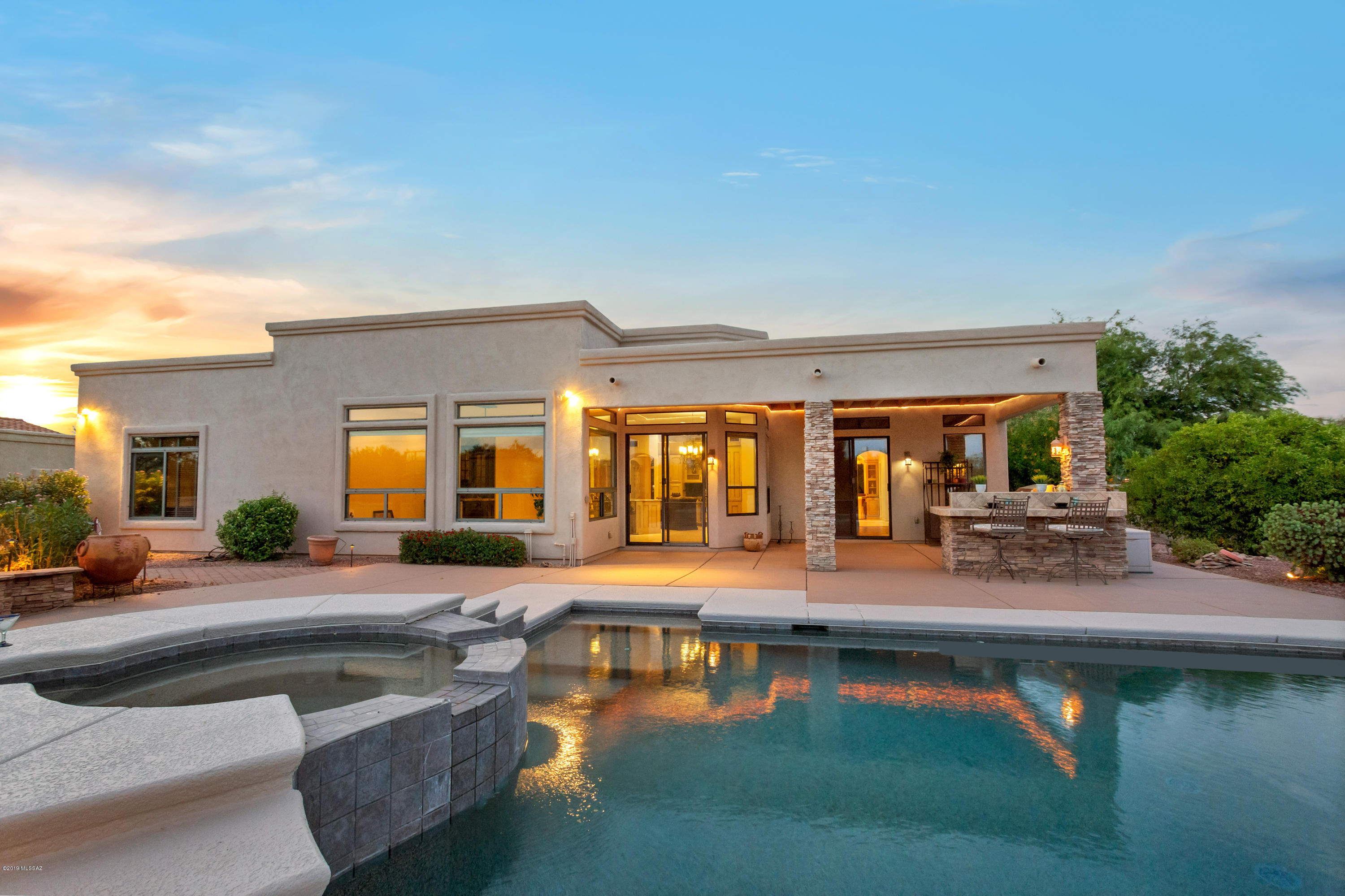 Highly upgraded, gorgeous semi-custom home on near half acre in idyllic OV nbrhd. Versatile split plan w/high ceilings & bonus game rm could be guest qtrs/MIL suite/hobby space. N/S orient w/Catalina Mt VIEWS! Upgrades incl: paver drive & front courtyd, stack stone detail, solid alder int doors & baseboards, 22'' neutral diag-laid tile, wood floor in master, DR & den, motorized shades, high-end lighting/fixtures. Remodeled baths w/custom cabs, marble in master,granite in other baths. Remodeled chef's kitchen features prof Viking range & hood, counter depth fridge and 2 islands. Bkyd is dream entertainment & family-fun space with pebble tec pool & spa, outdoor kitchen,citrus trees, fireplace & banco,lower yd w/bball court. Walk/bike to excelling OV schools. Home warranty incl. Owner/Agen