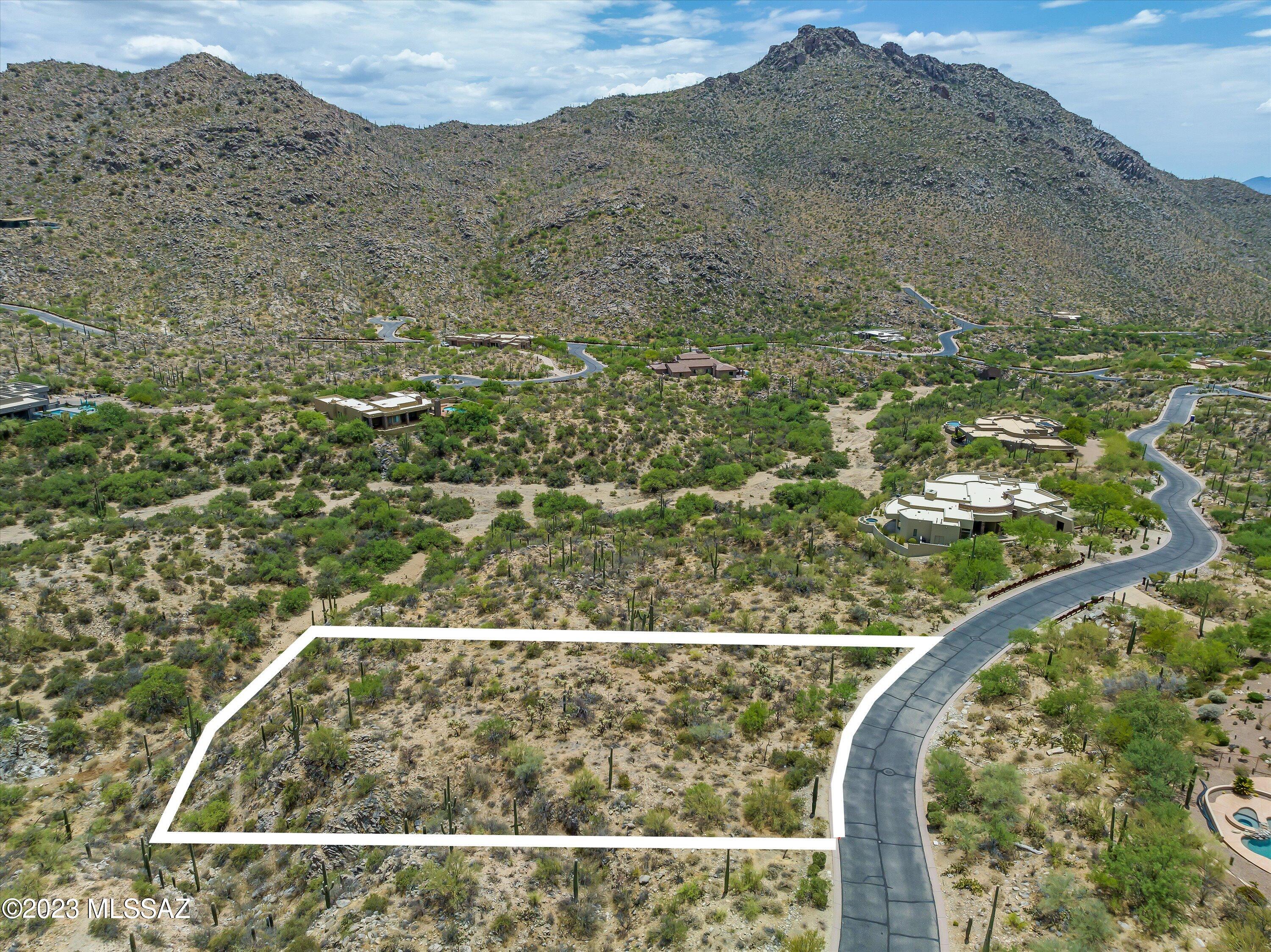 Come experience this beautiful homesite in the serene, saguaro studded, Canyon Pass at Dove Mountain. Nestled in the Tortolita Mountains northwest of Tucson, AZ, this 1.64 acre gently sloping lot offers panoramic mountain views and privacy. This is the ideal setting for the custom home you have dreamt. Enjoy the amenities of Dove Mountain, including the Ritz Carlton Golf Club and The Gallery Golf Club.