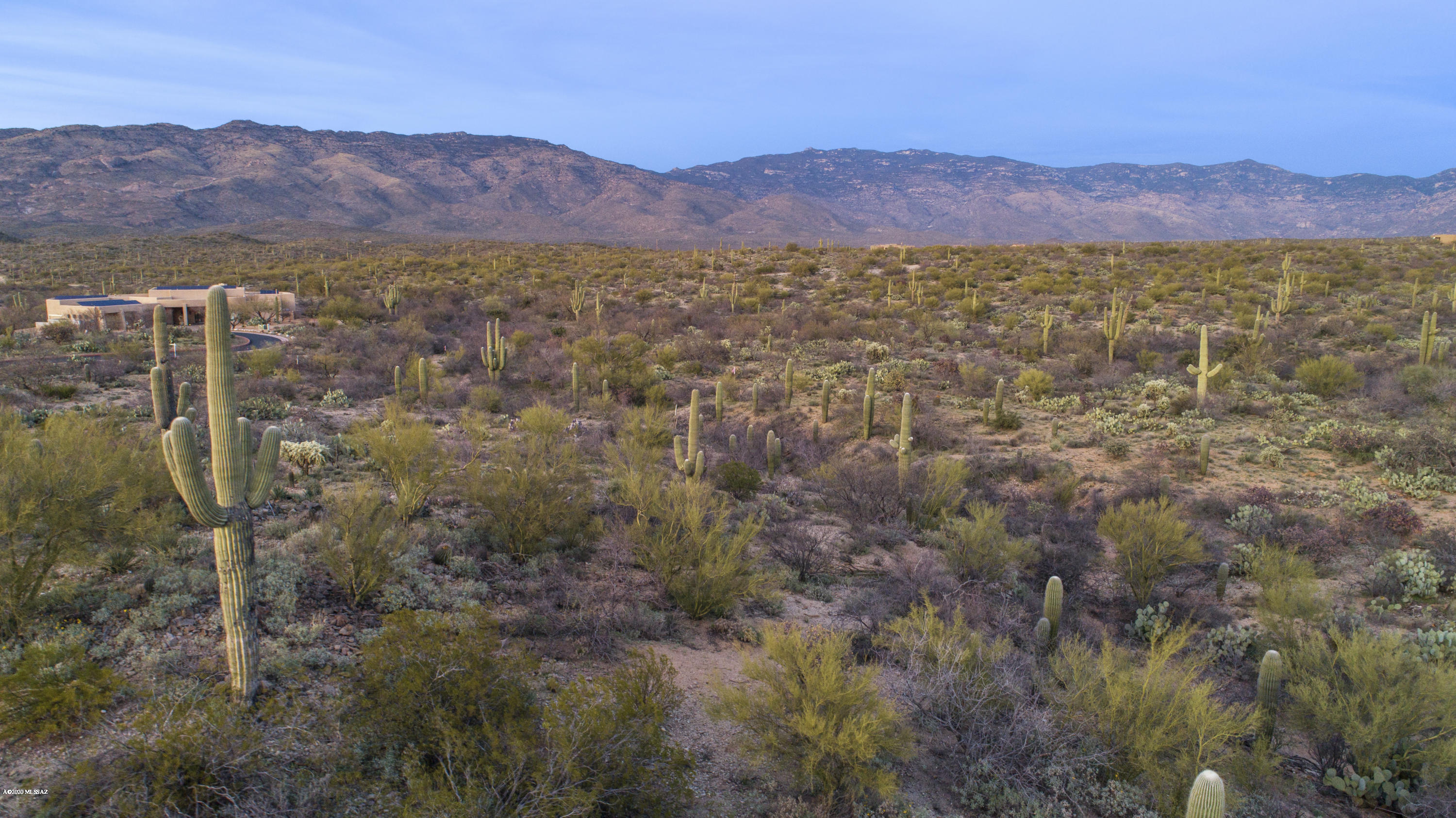 Imagine building your dream home on this amazing lot with breathtaking mountain views! Nestled in the most serene, private, & upscale section of Coyote Creek, this lot has everything you need to build your dream home. Endless possibilities w/this 1.91ac lot & its extra-large 18,000sf building envelope for your home, RV garage, pool & casita. Septic engineered documents in-hand supporting a standard system. All 4 building envelope corners staked w/ pink ribbons to easily visualize your home. Future driveway approach marked w/ flags. Engineered documents for culvert approach to lot. Minimal excavation (cut&fill) for house pad. Perfect north/south home orientation for energy efficiency while maintaining mountain views. Located at end of cul de sac w/o thru traffic. Majestic saguaros (most outside bldg envelope) w/ natural vegetation. Lot borders beautiful canyon wash for added privacy. Lot is surrounded by high-end custom homes. Long Bar Ranch Place has its own private security gate. Many Coyote Creek residents are horse lovers who take advantage of the state-of-the-art Equestrian Center for boarding and riding/training as well as the Recreation Center with Covered Ramada with wood burning fireplace, Gas Barbeque, Tennis court with lights,  Badminton courts, Two Pickleball courts &  Volleyball sand court. Adjacent Lot 103  also offered.